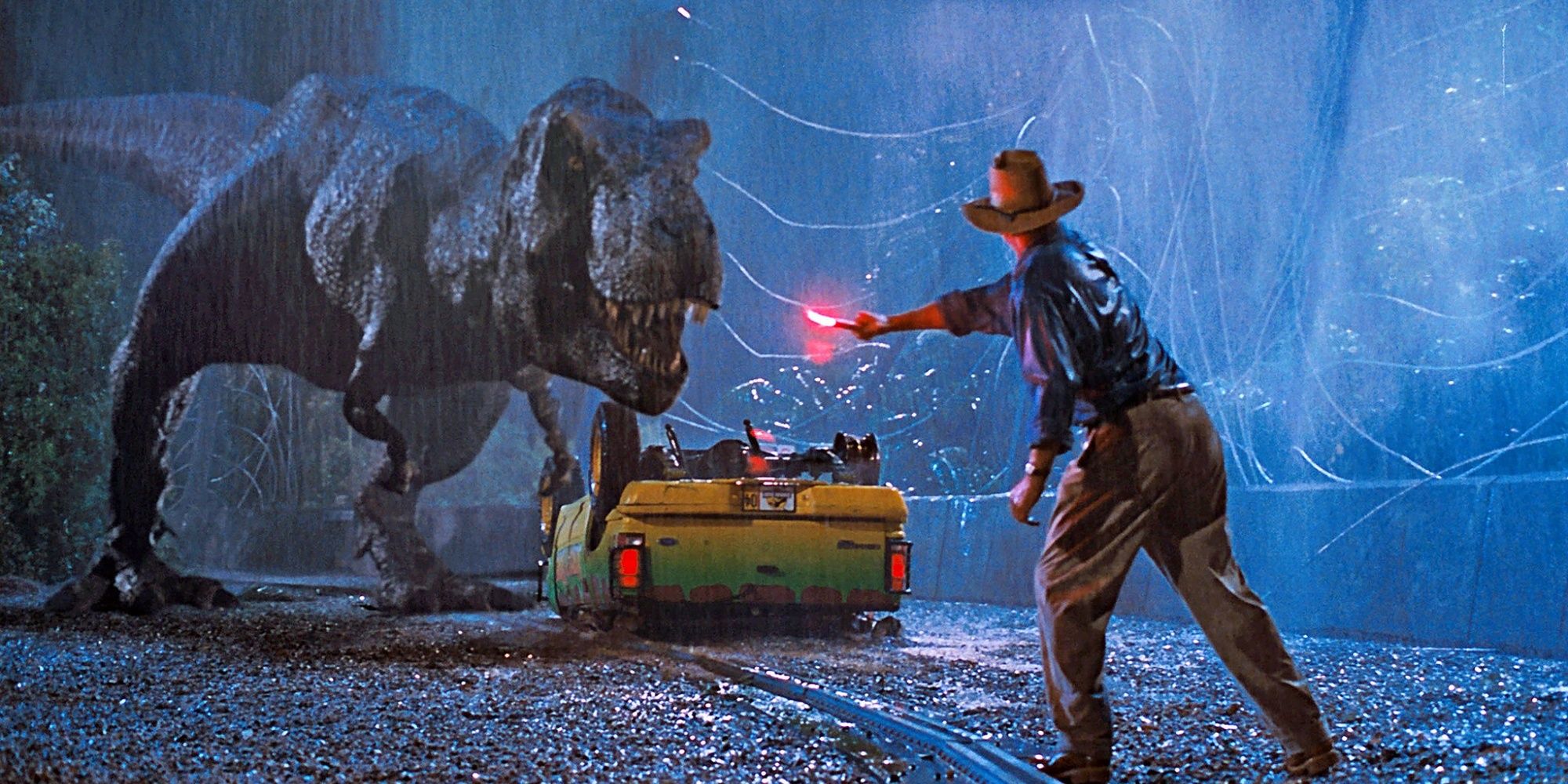 Dr Alan Grant mencoba mengalihkan perhatian T-Rex di luar Jeep di Jurassic Park.