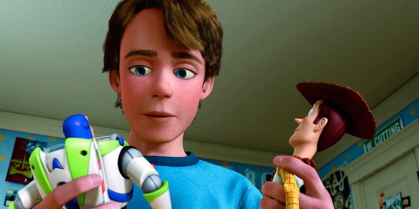 Andy with Buzz and Woody in Toy Story 3