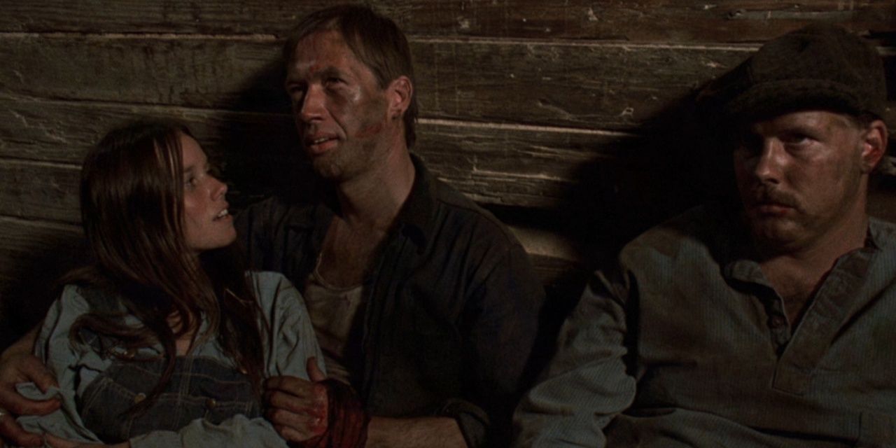 Boxcar Bertha, David Carradine, arms around Bertha, Barbara Hershey, on a train