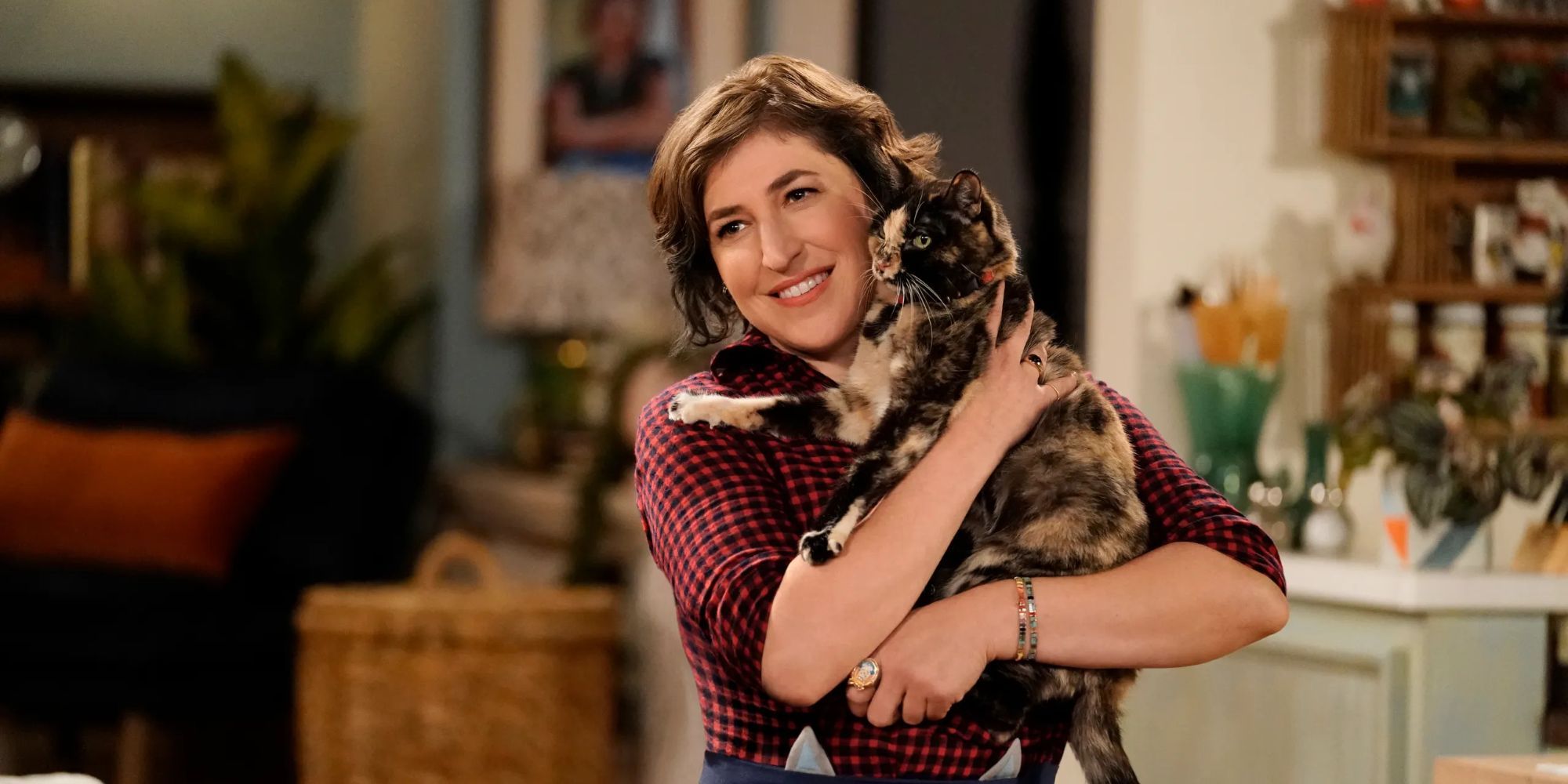 A woman holding a cat