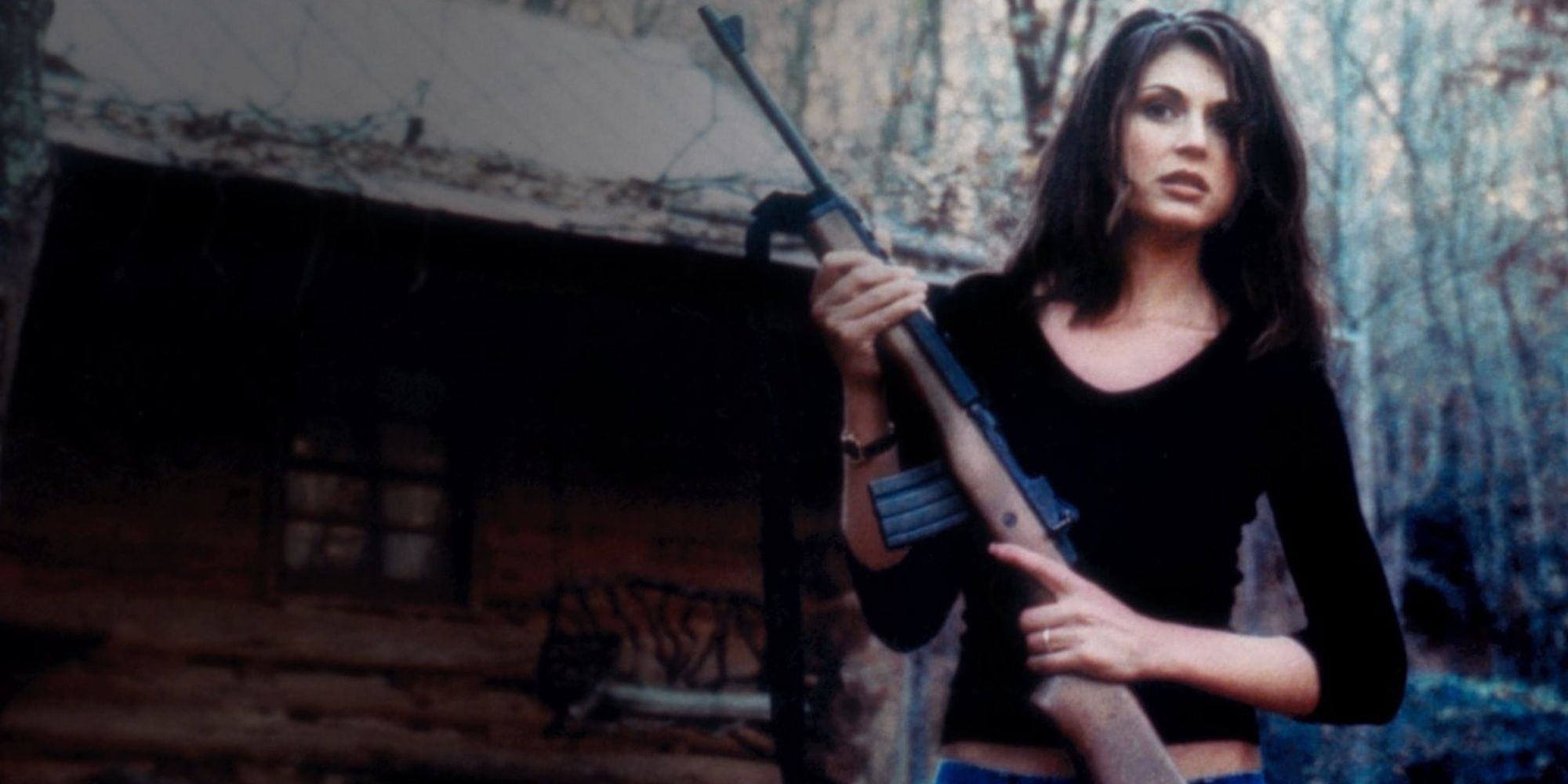Cerina Vincent holding a gun in Cabin Fever