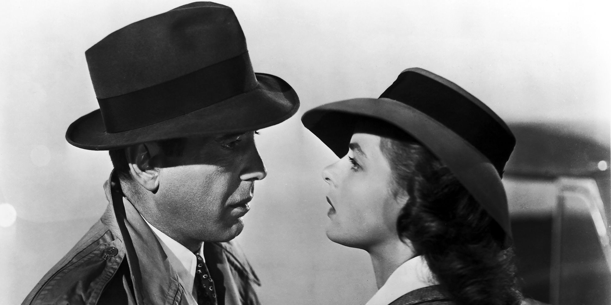 Humphrey Bogart as Rick Blaine and Ingrid Bergman as Ilsa Lund looking at each other in Casablanca
