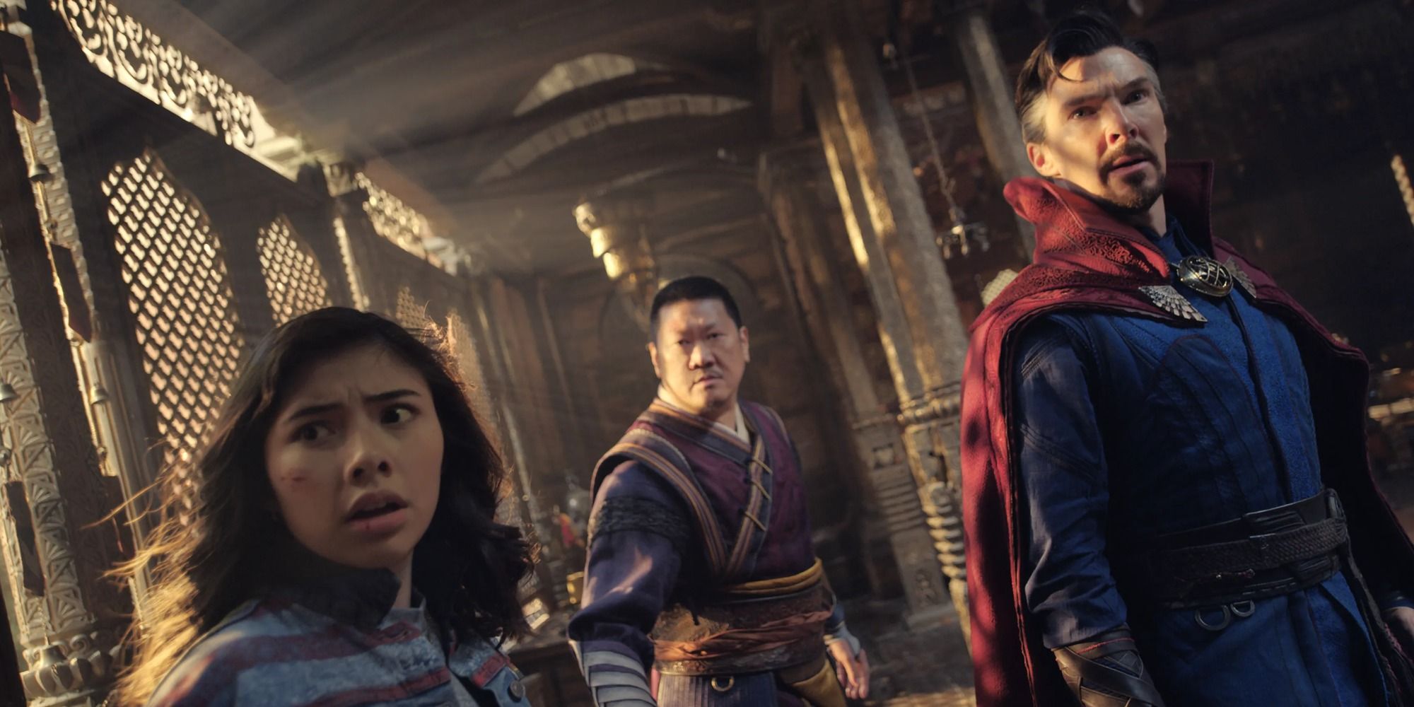 America Chavez, Sorcerer Supreme Wong, and Doctor Strange staring off to the side