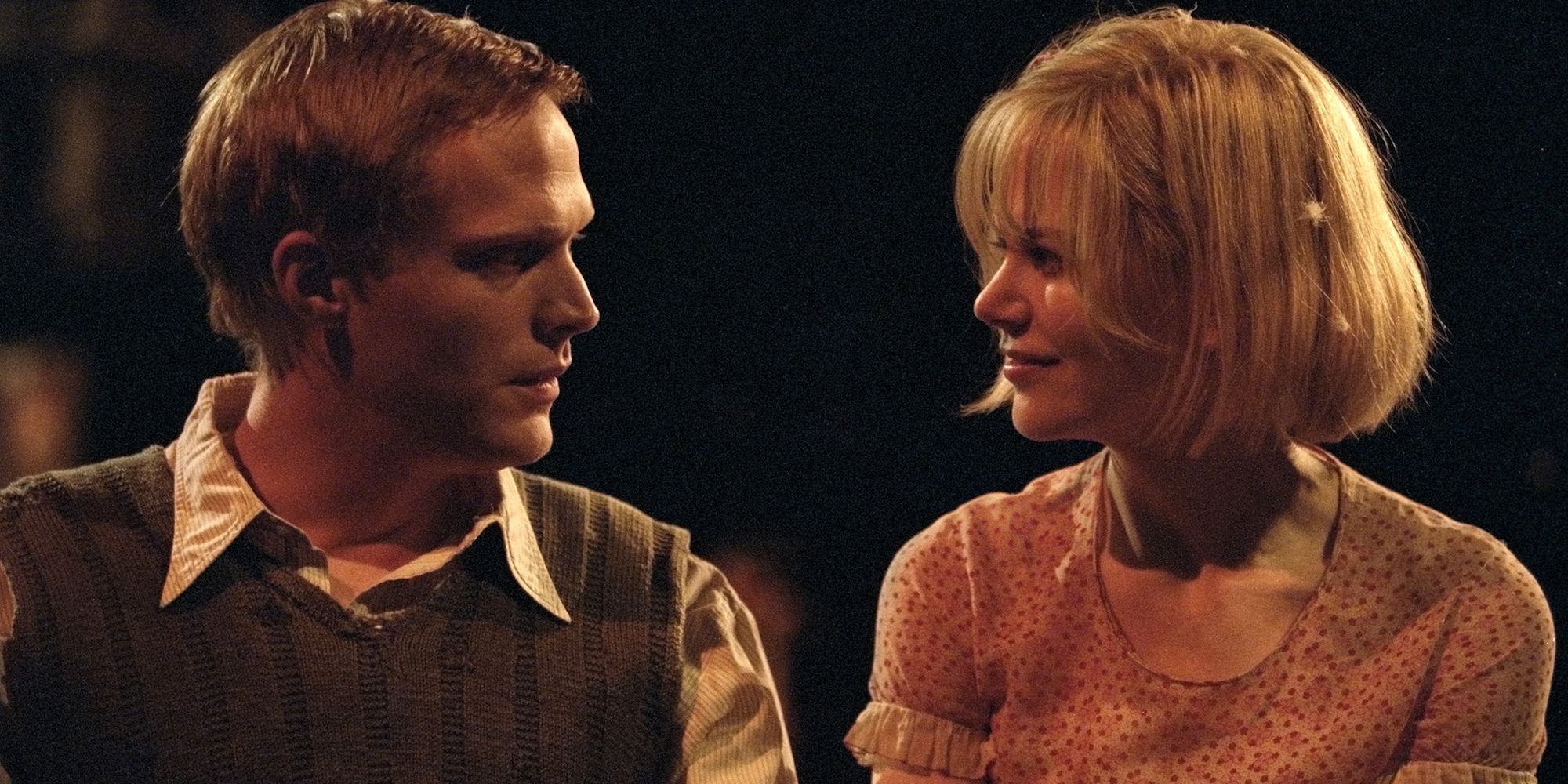 Tom Edison (Paul Bettany) looks to Grace Margaret Mulligan (Nicole Kidman) who smiles back at him.