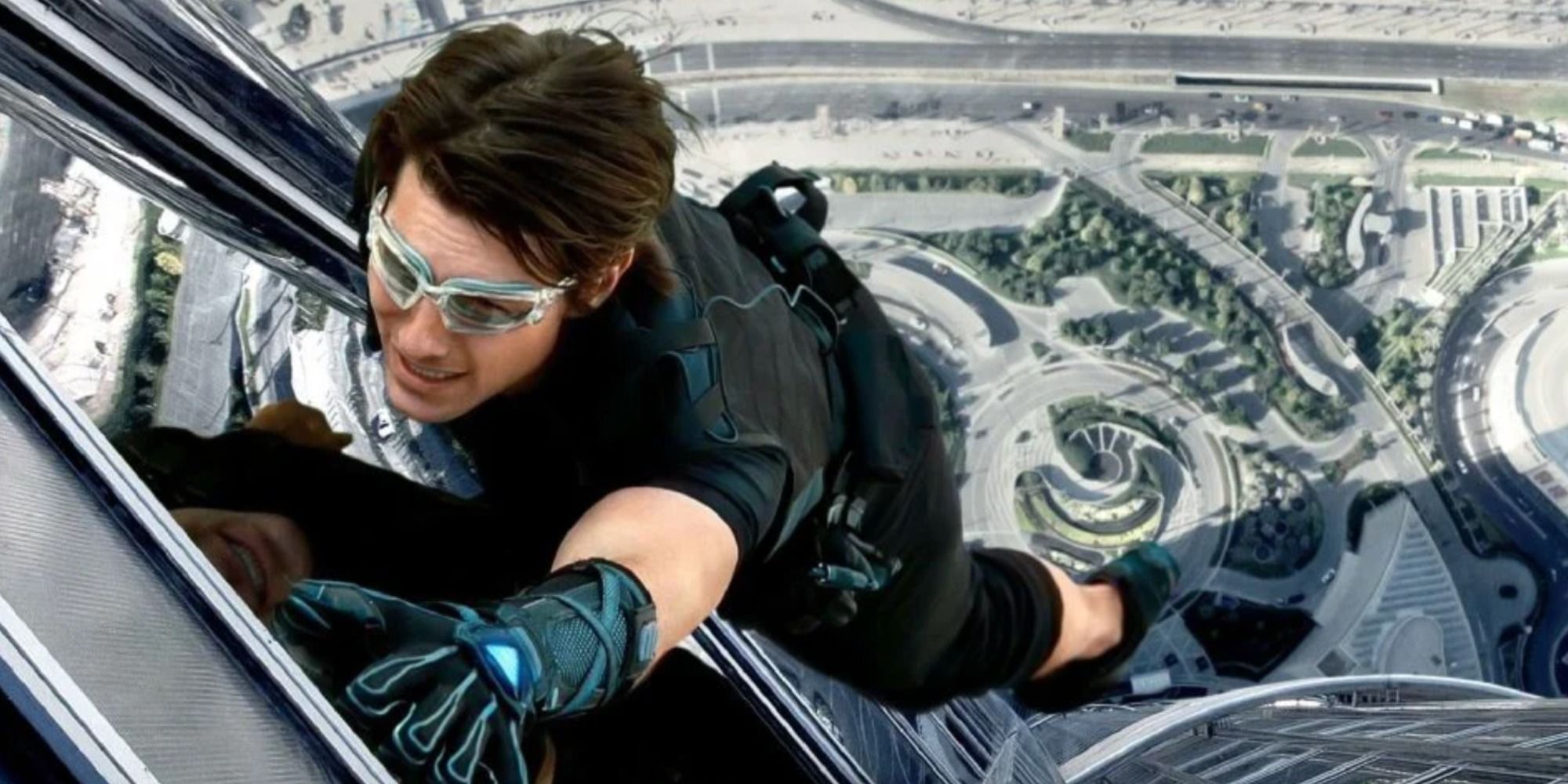 Tom Cruise as Ethan Hunt scaling the side of the Burj Khalifa in Mission: Impossible - Ghost Protocol