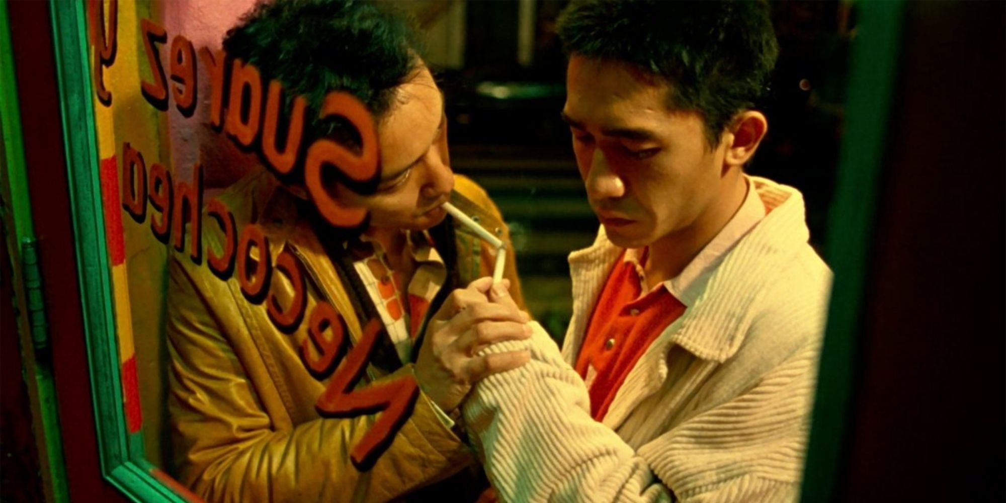 Leslie Cheung and Tony Leung smoking together outside in Happy Together
