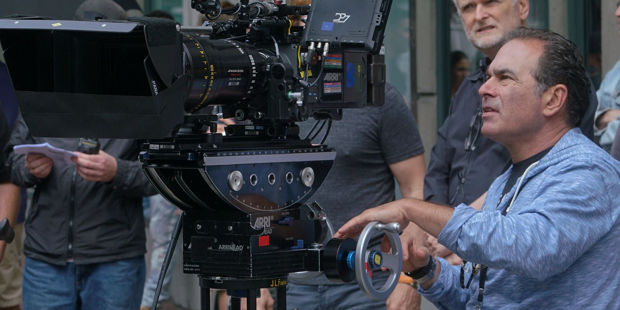 cinematographer John Schwartzman with a movie camera