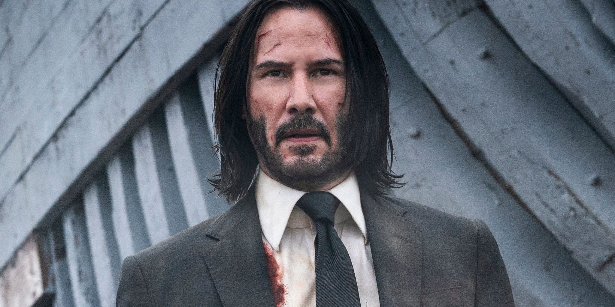 John Wick all bloody and staring off into the distance - john wick Cropped