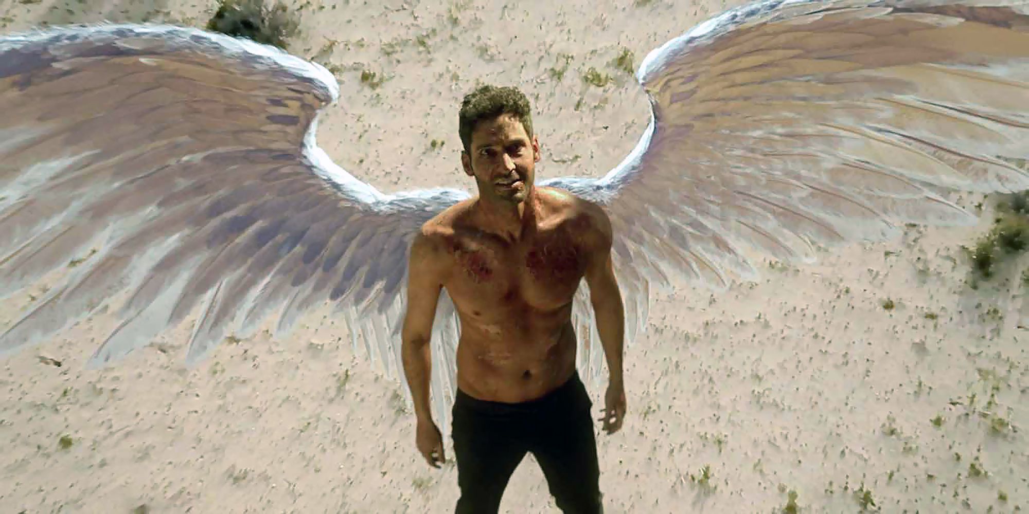 Tom Ellis with angel wings in Lucifer