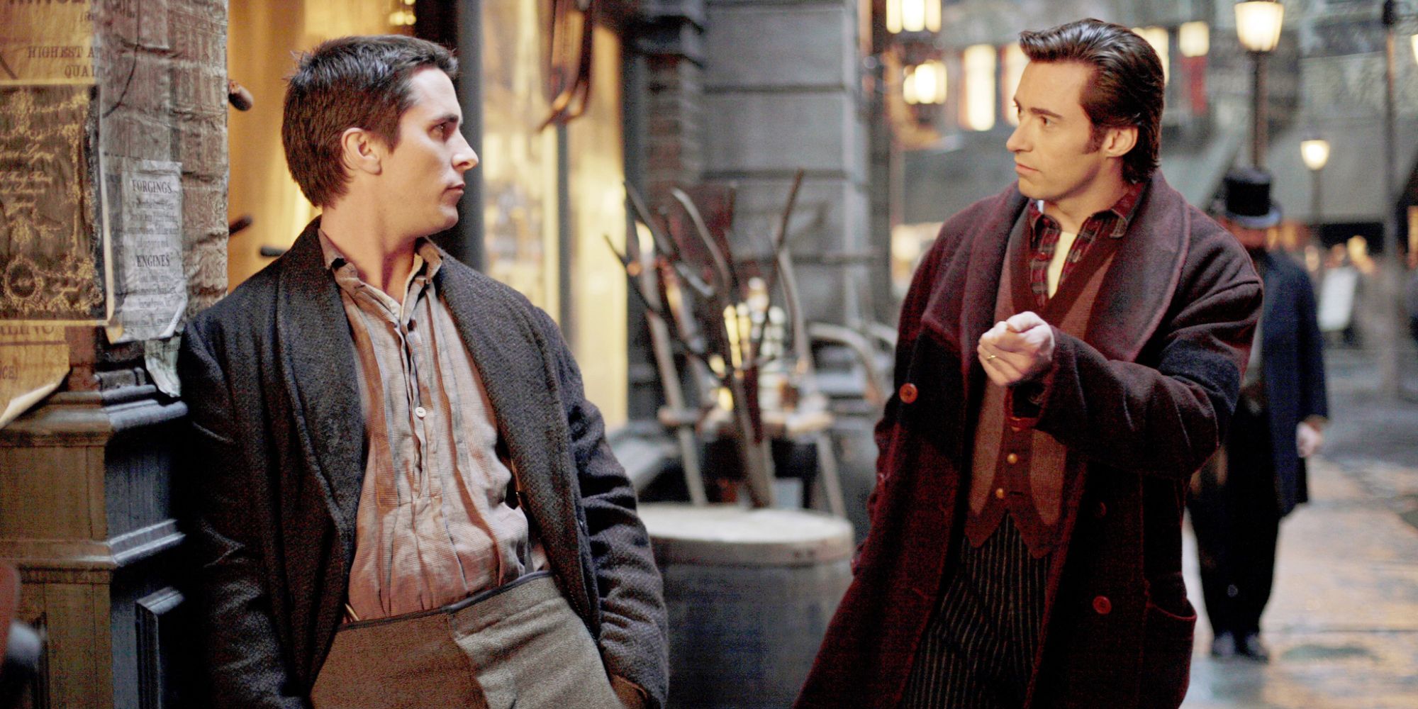 Christian Bale and Hugh Jackman standing in the streets of 1890s London, discussing the method of a magic trick