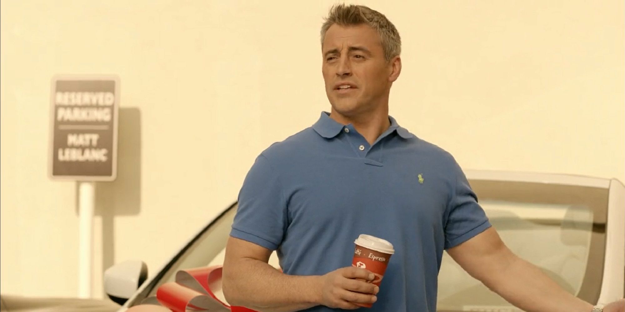 Matt LeBlanc holding a coffee cup in Episodes