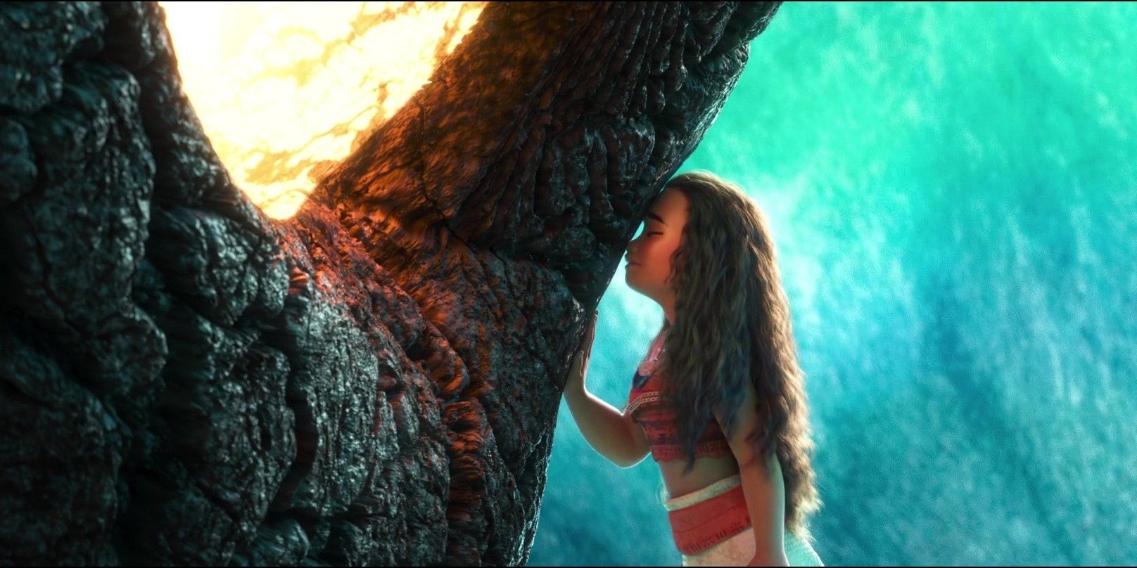Moana tenderly touches her forehead to a tree in 'Moana' (2016).