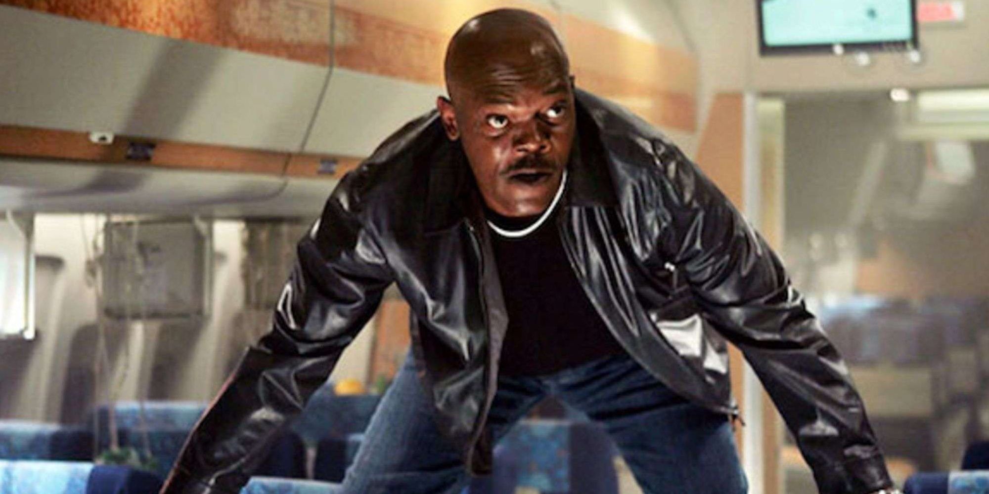 Samuel L. Jackson on top of some plane seats in Snakes On a Plane.