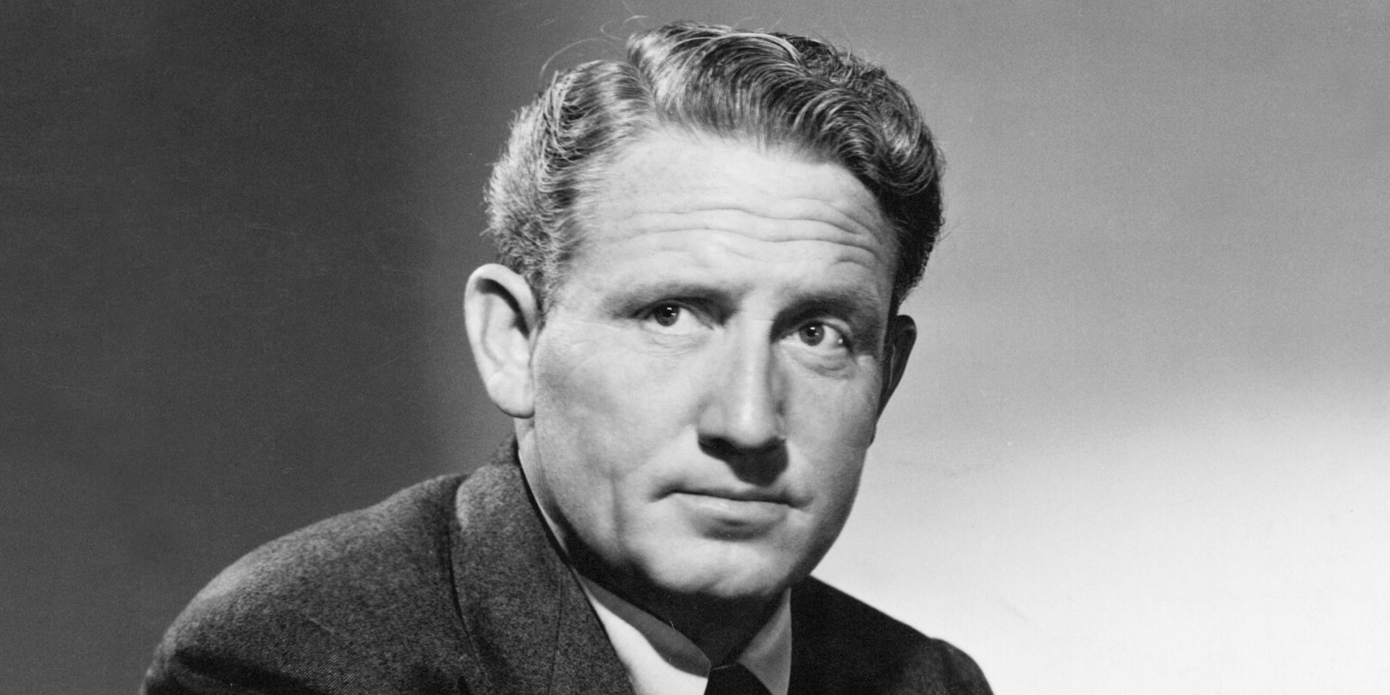 Spencer Tracy in an old portrait looking to the distance.