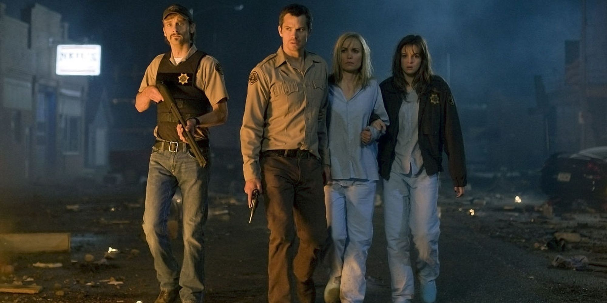 The main cast of The Crazies walking through an abandoned street
