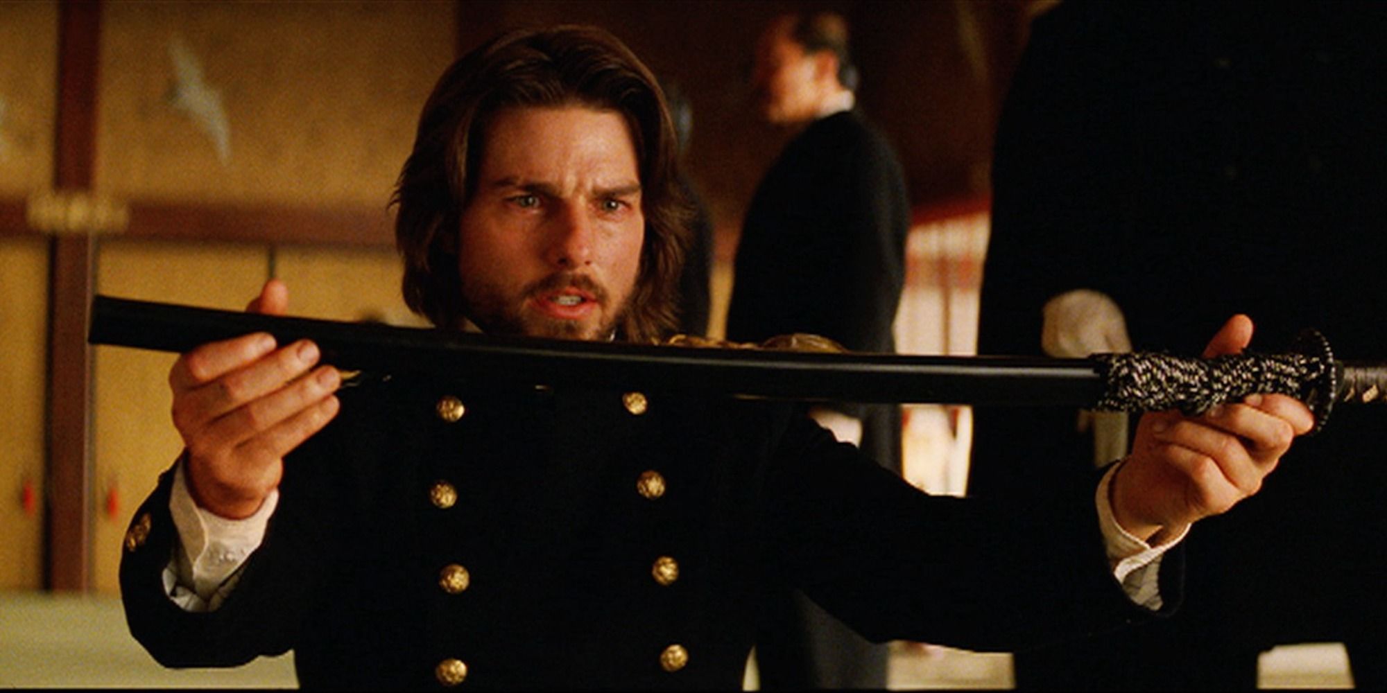 Tom Cruise as Nathan Algren, holding a sword with tears in his eyes , in The Last Samurai 