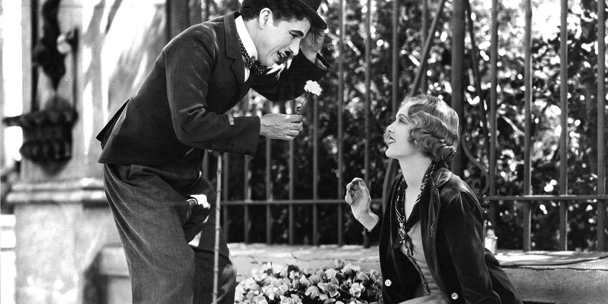 The Tramp offering a flower to the florist in City Lights