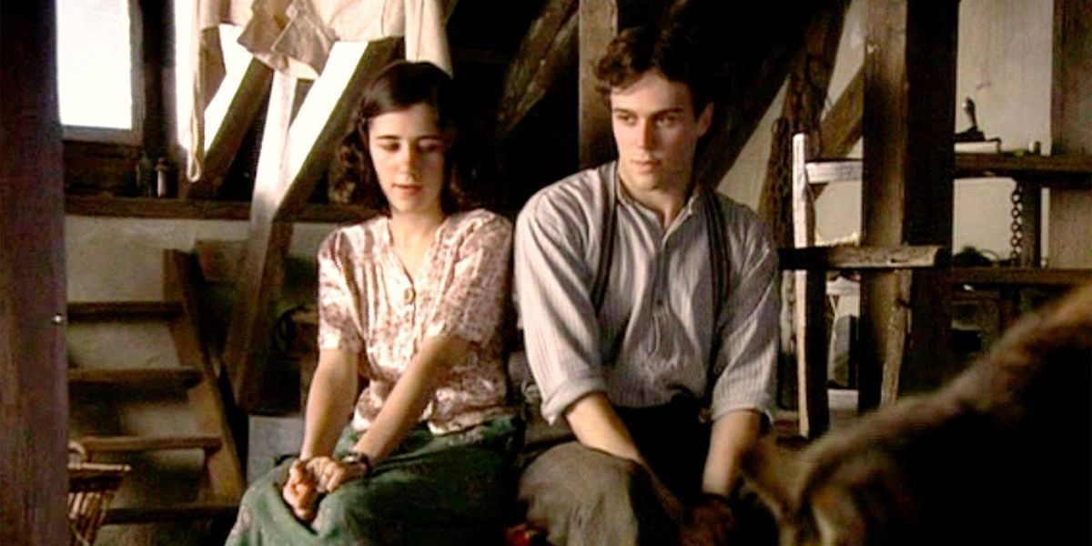 Ellie Kendrick and Geoffrey Breton as Anne and Peter sitting together in the annexed attic in "The Diary of Anne Frank"