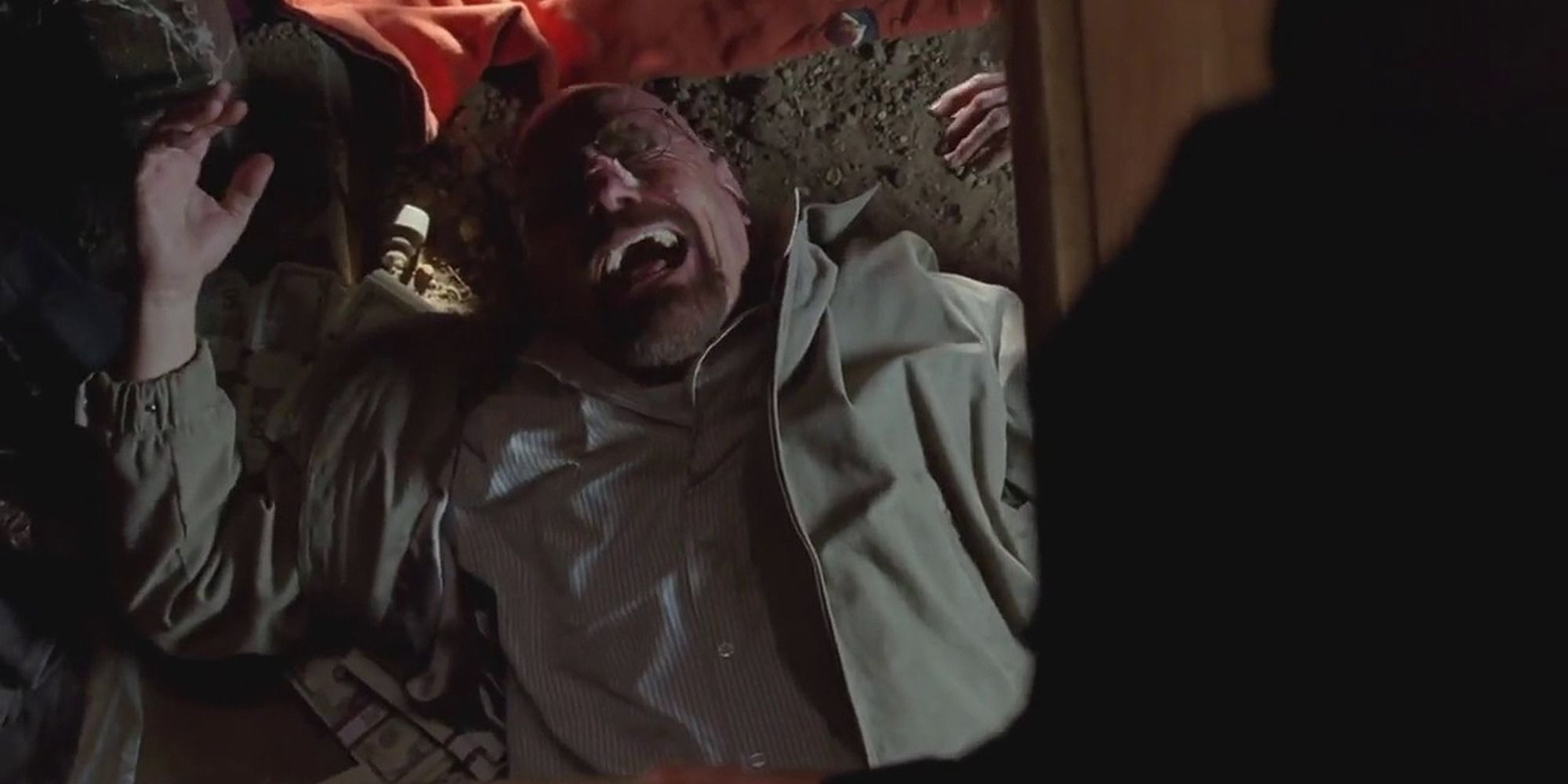 Walt from "Breaking Bad", lying on the ground of a crawl space and laughing