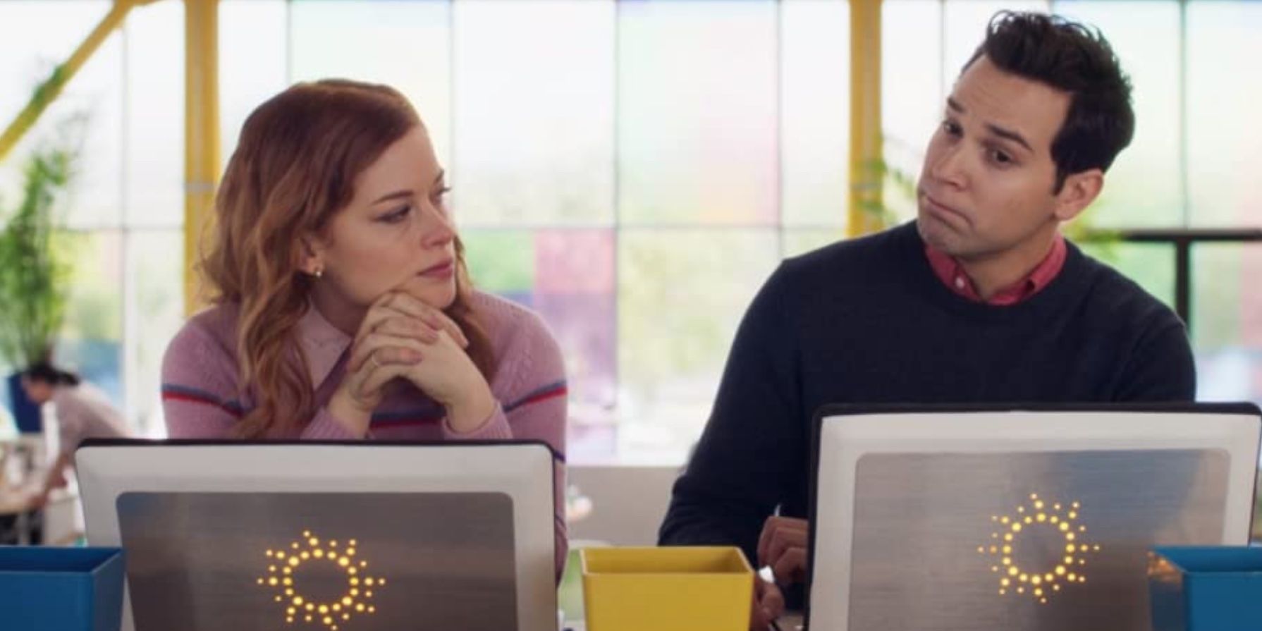 Jane Levy and Skylar Astin sitting in front of computers in 'Zoey's Extraordinary Playlist'