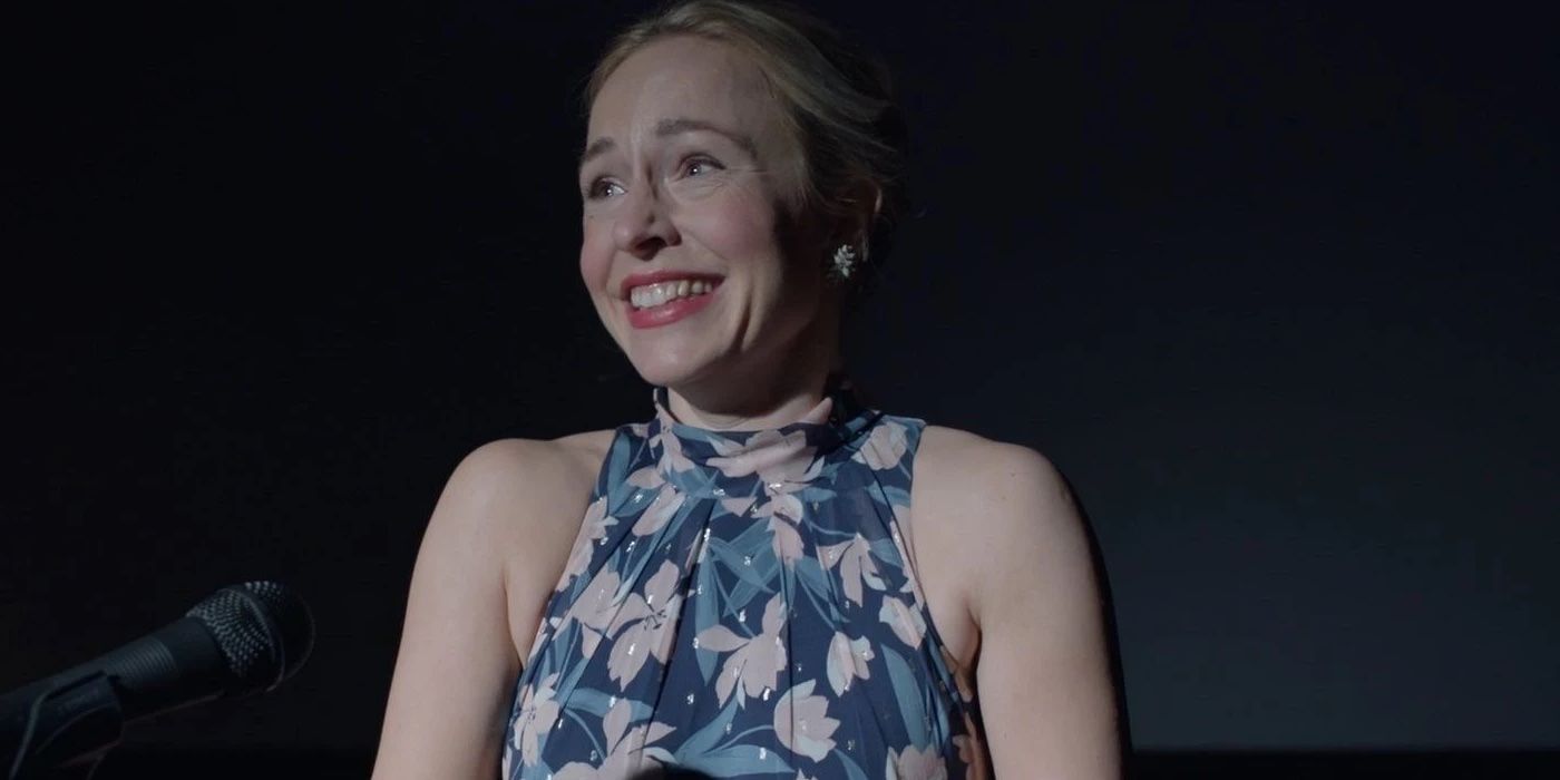Sarah Goldberg as Sally Reed smiling on stage in front of a microphone in Barry Season 3 Episode 4