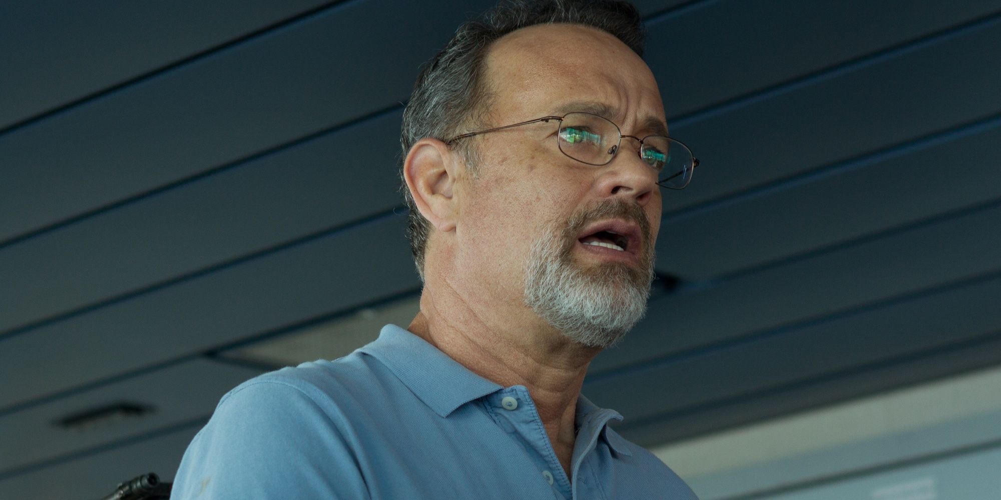 Richard Phillips with a scared expression while in looking ahead in Captain Phillips