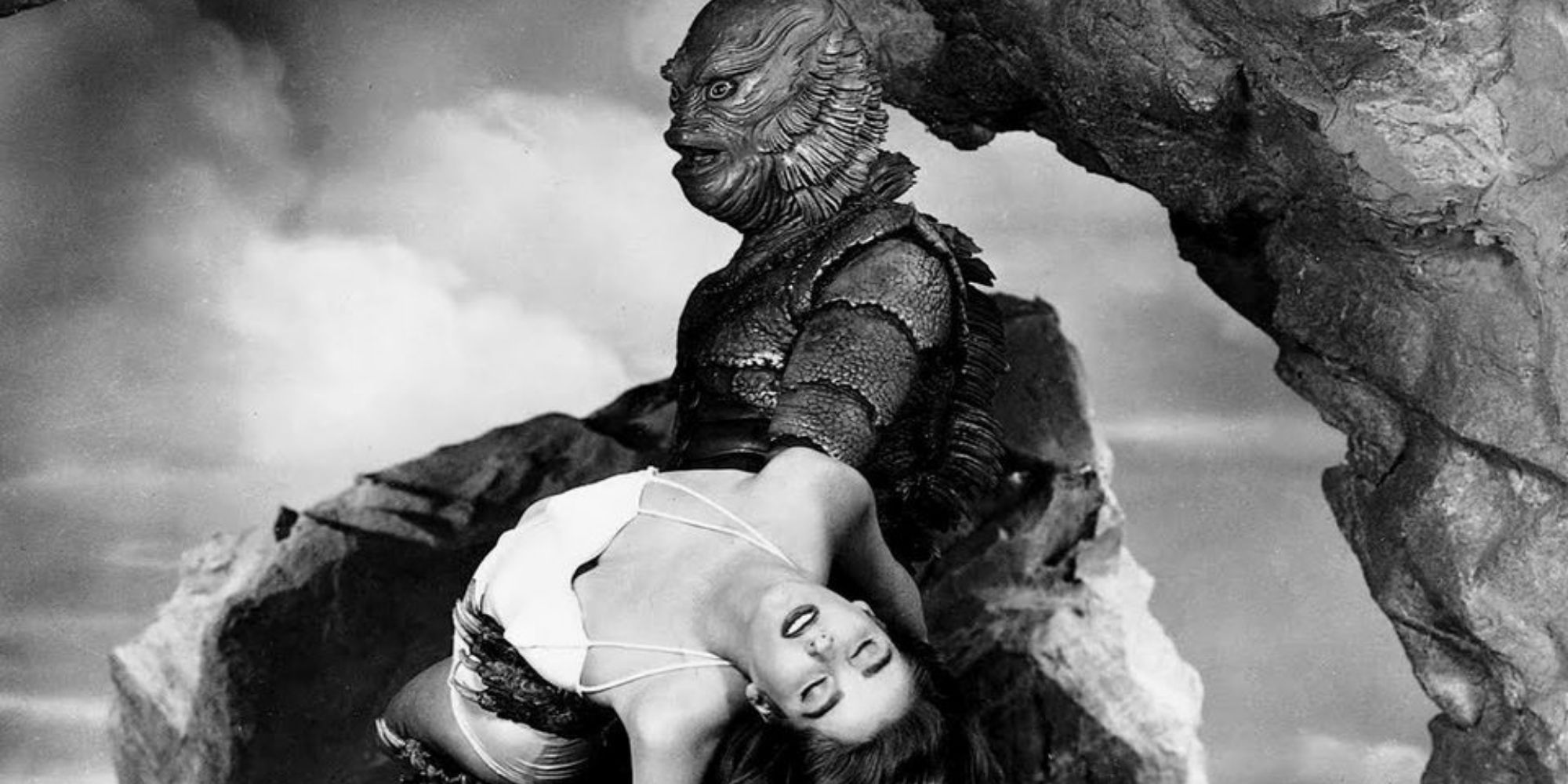 Sea monster carrying fainted woman in The Creature From the Black Lagoon