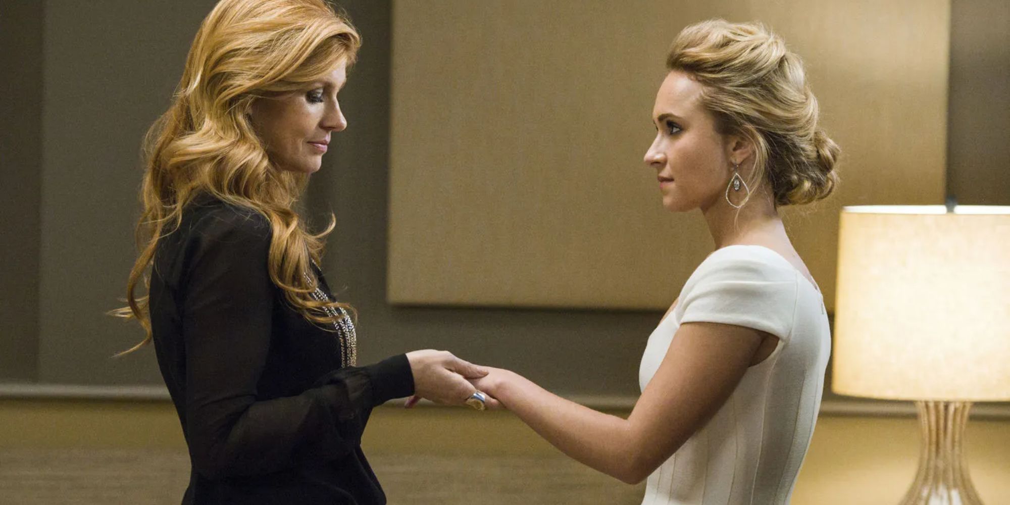 Rayna James and Juliette Barnes holding hands in Nashville