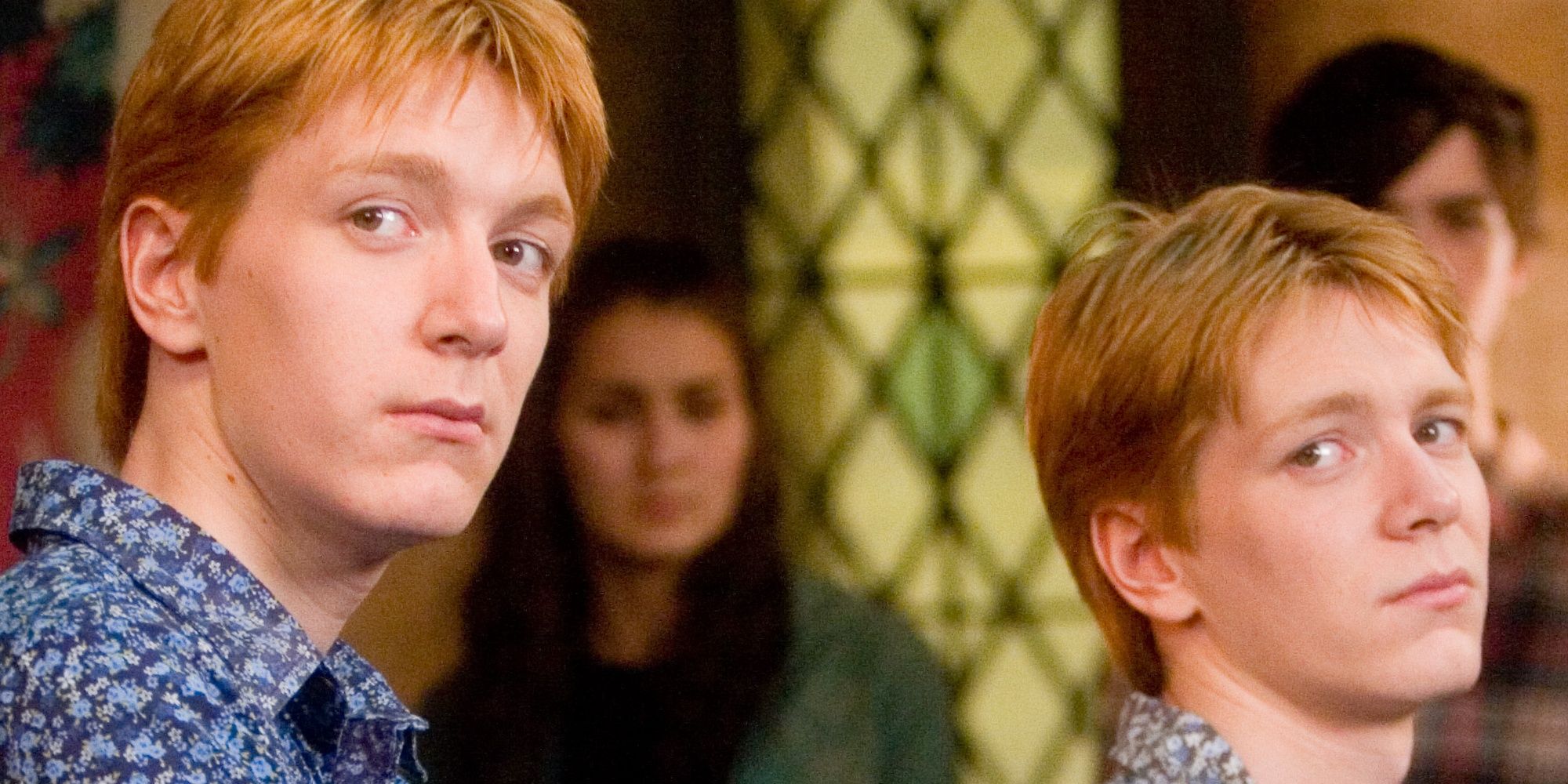 a close up of the weasley twins from harry potter