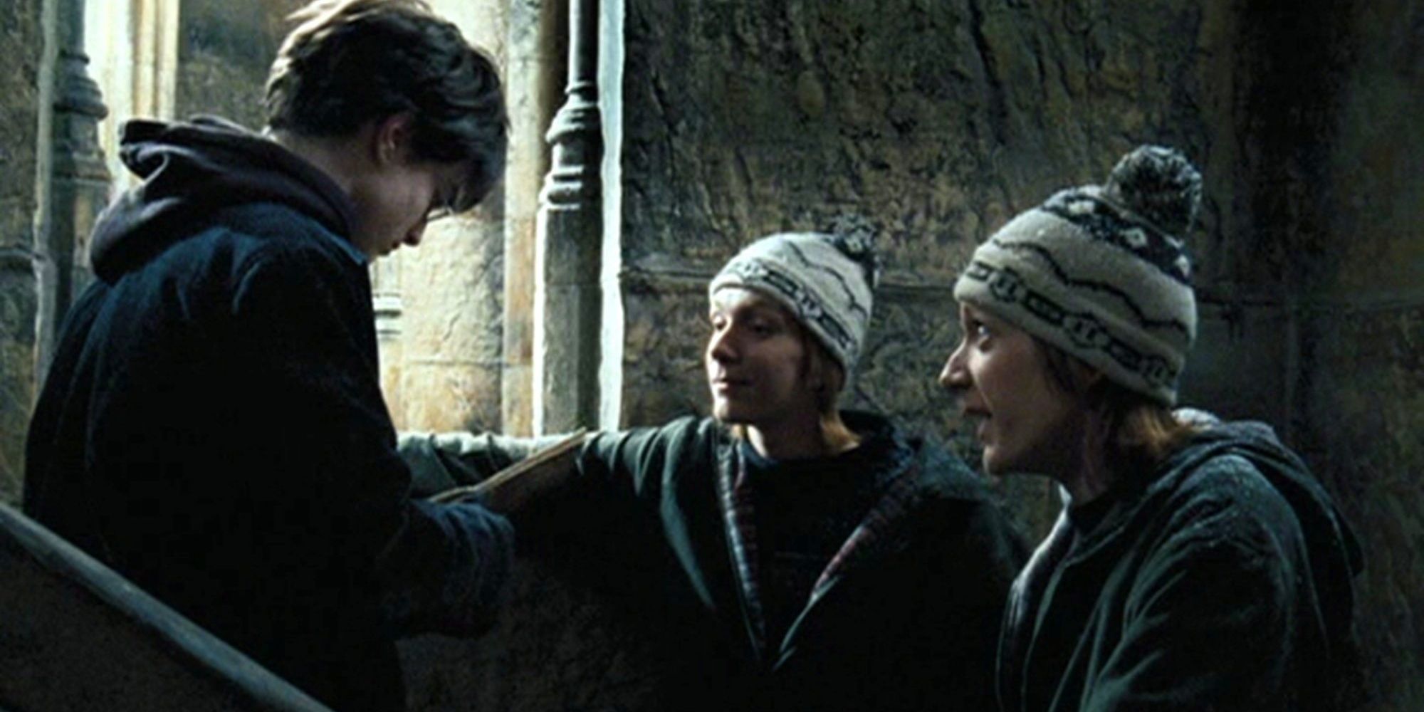 Fred and George Weasley and Harry Potter talking about the Marauder's Map in 'Harry Potter and the Prisoner of Azkaban.'