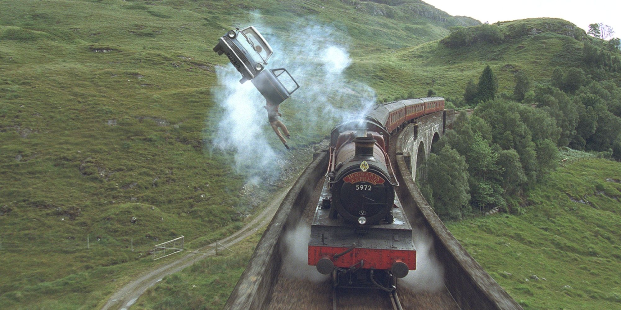 The Weasley's flying car and the Hogwarts Express on their way to Hogwarts in Harry Potter and the Chamber of Secrets