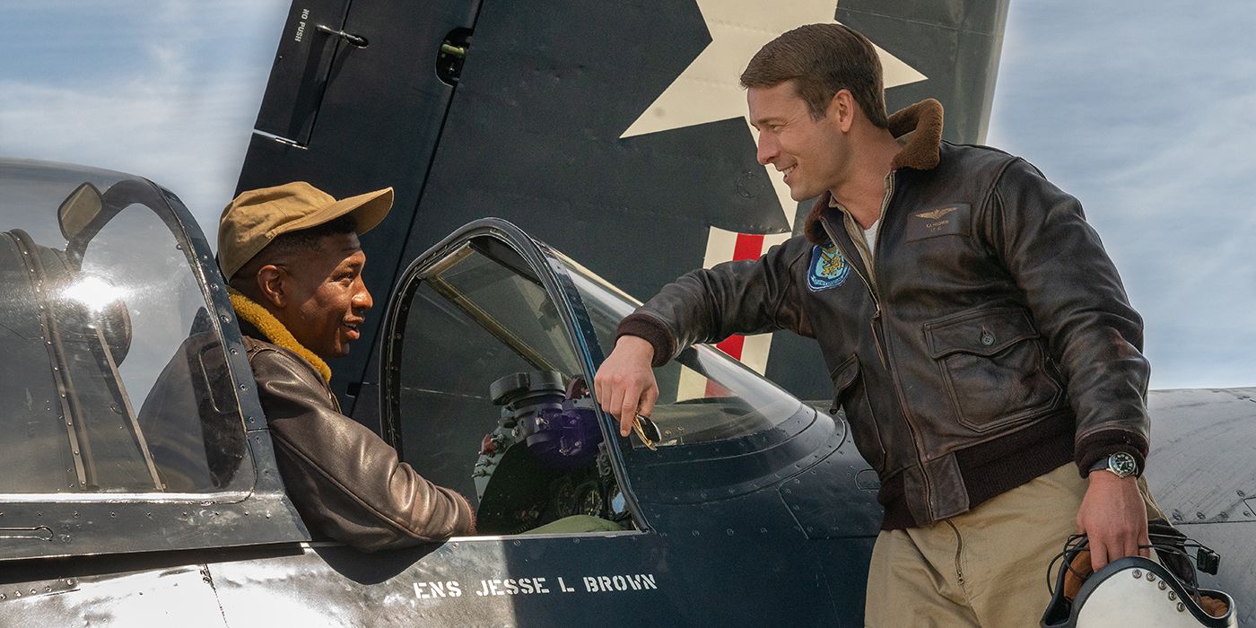 Glen Powell talks to Jonathan Majors, who sits in the cockpit of a fighter plane in Devotion