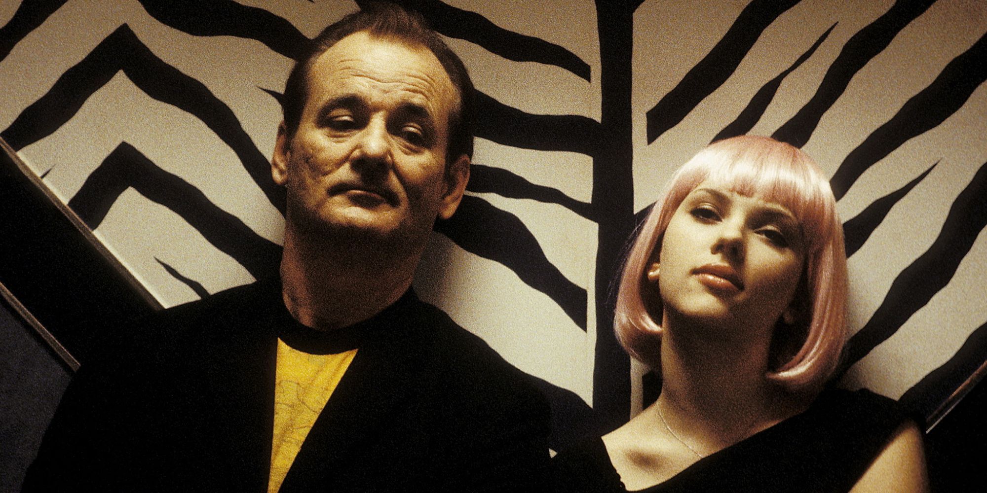 Bill Murray and Scarlett Johansson sitting side by side as Bob and Charlotte in 'Lost in Translation'.