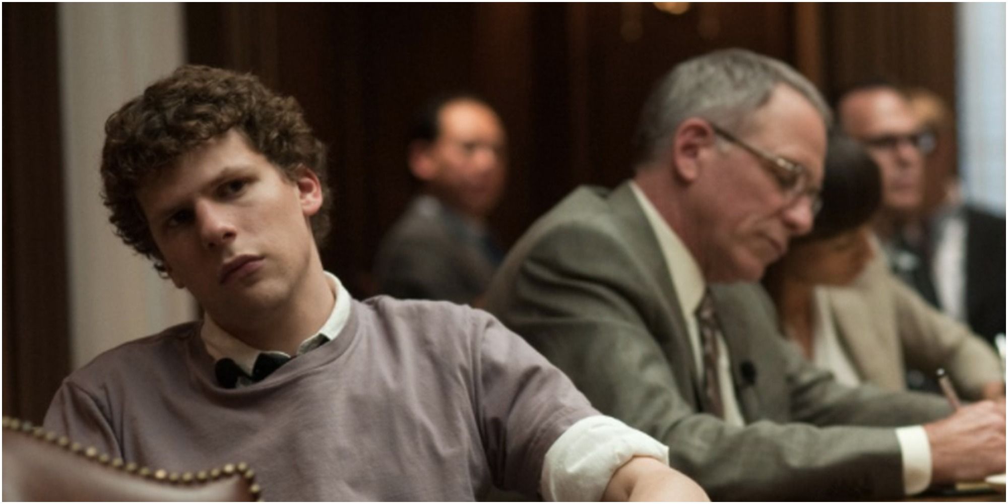 Jesse Eisenberg sits with John Getz in David Fincher's The Social Network
