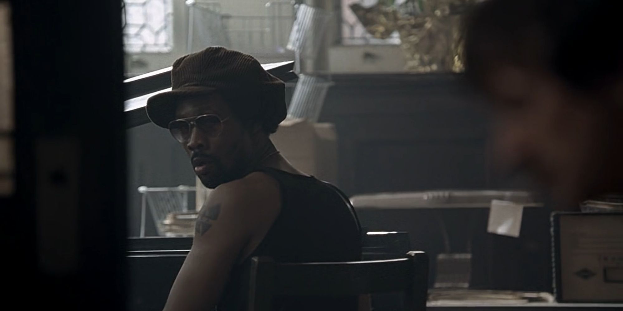 rza in american gangster at desk with John Hawkes