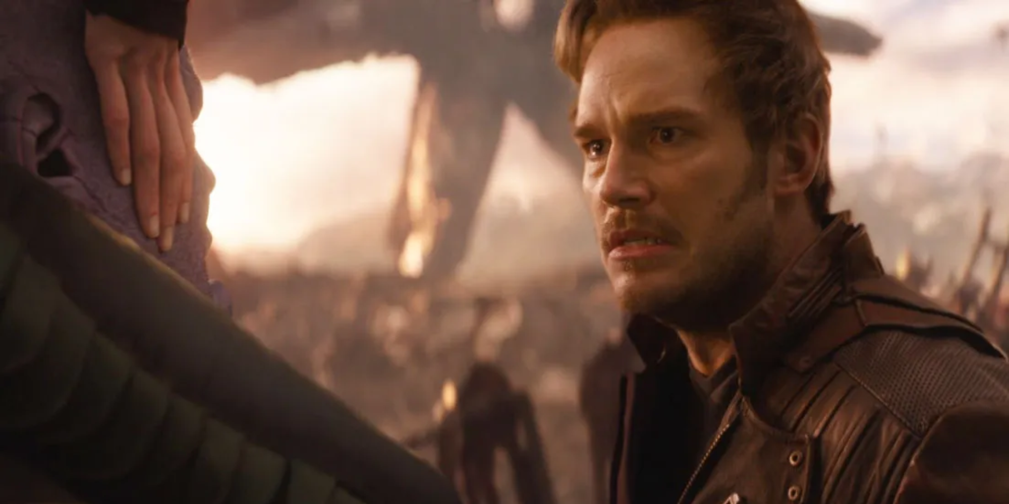 Starlord looks at Thanos 