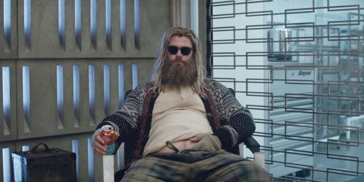 Thor, played by Chris Hemsworth, wearing sunglasses and seated in Avengers: Endgame