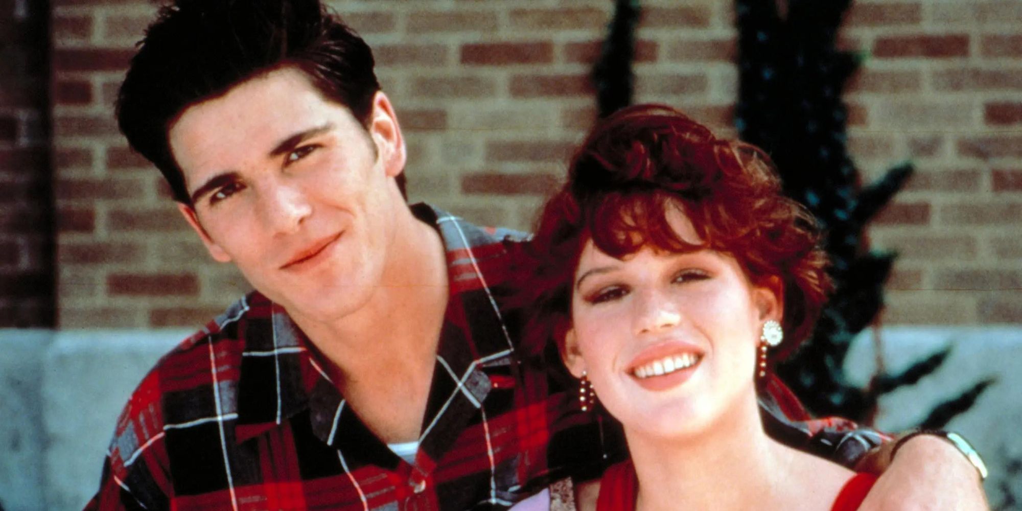 Jake and Sam from 16 Candles standing cozily
