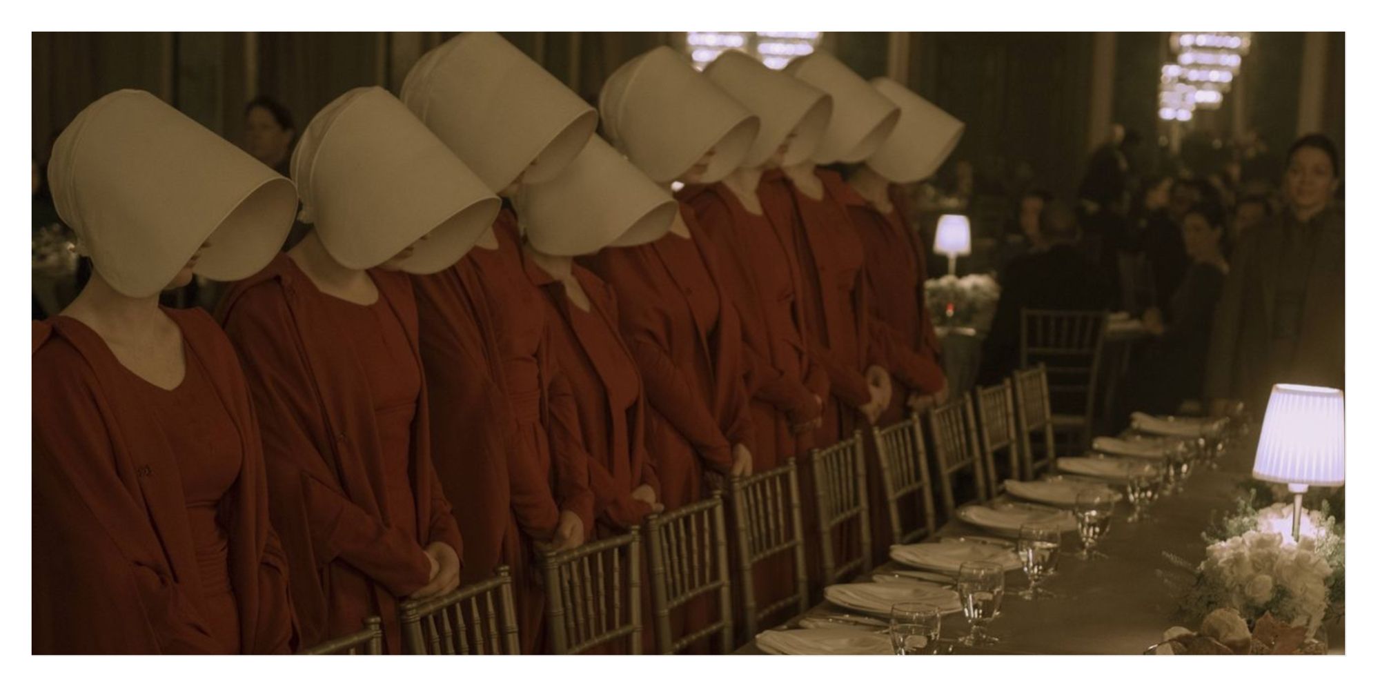 A line of handmaids at a celebration ceremony