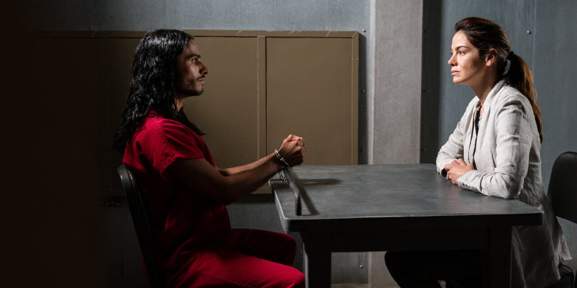 an agent interrogating a male inmate