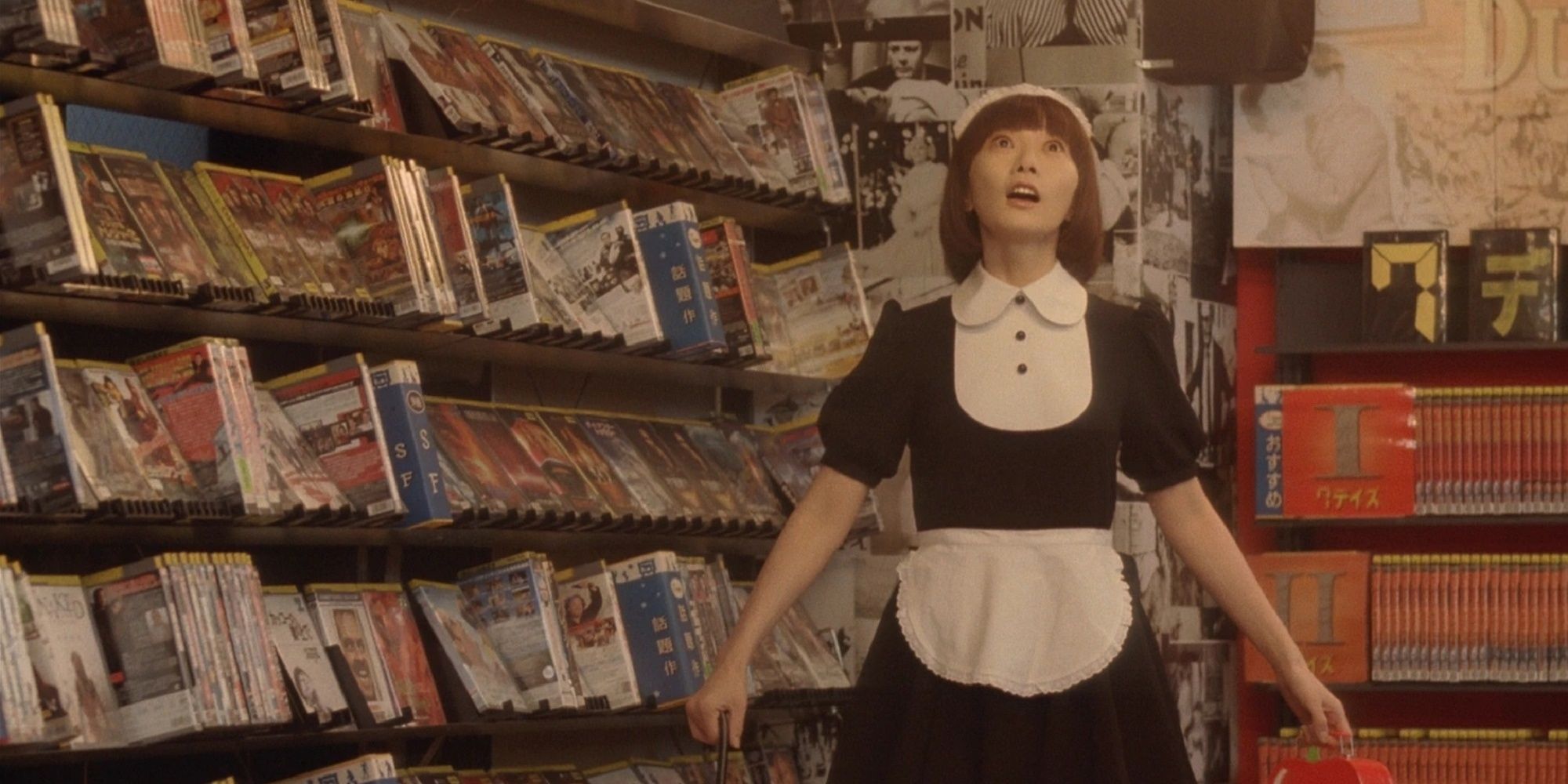 Bae Doona in a maid costume in the video rental store in Air Doll.
