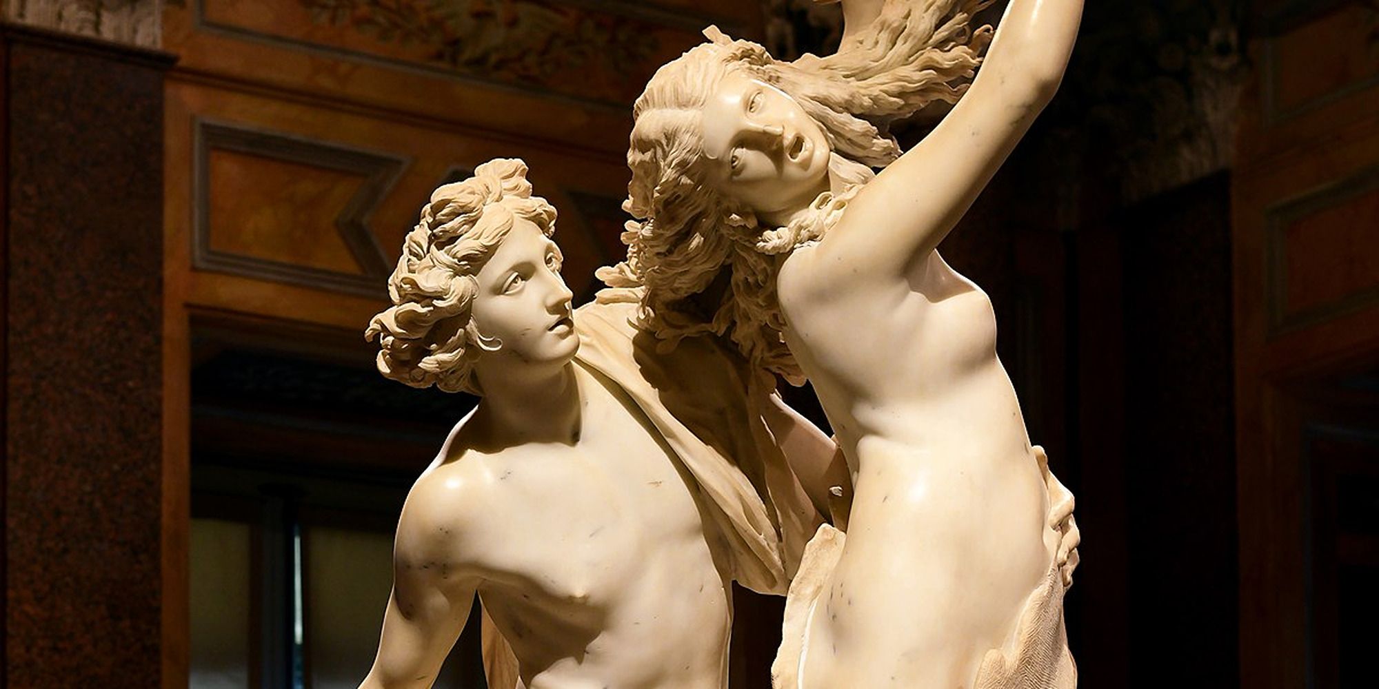 sculpture of a man stalking a scared woman