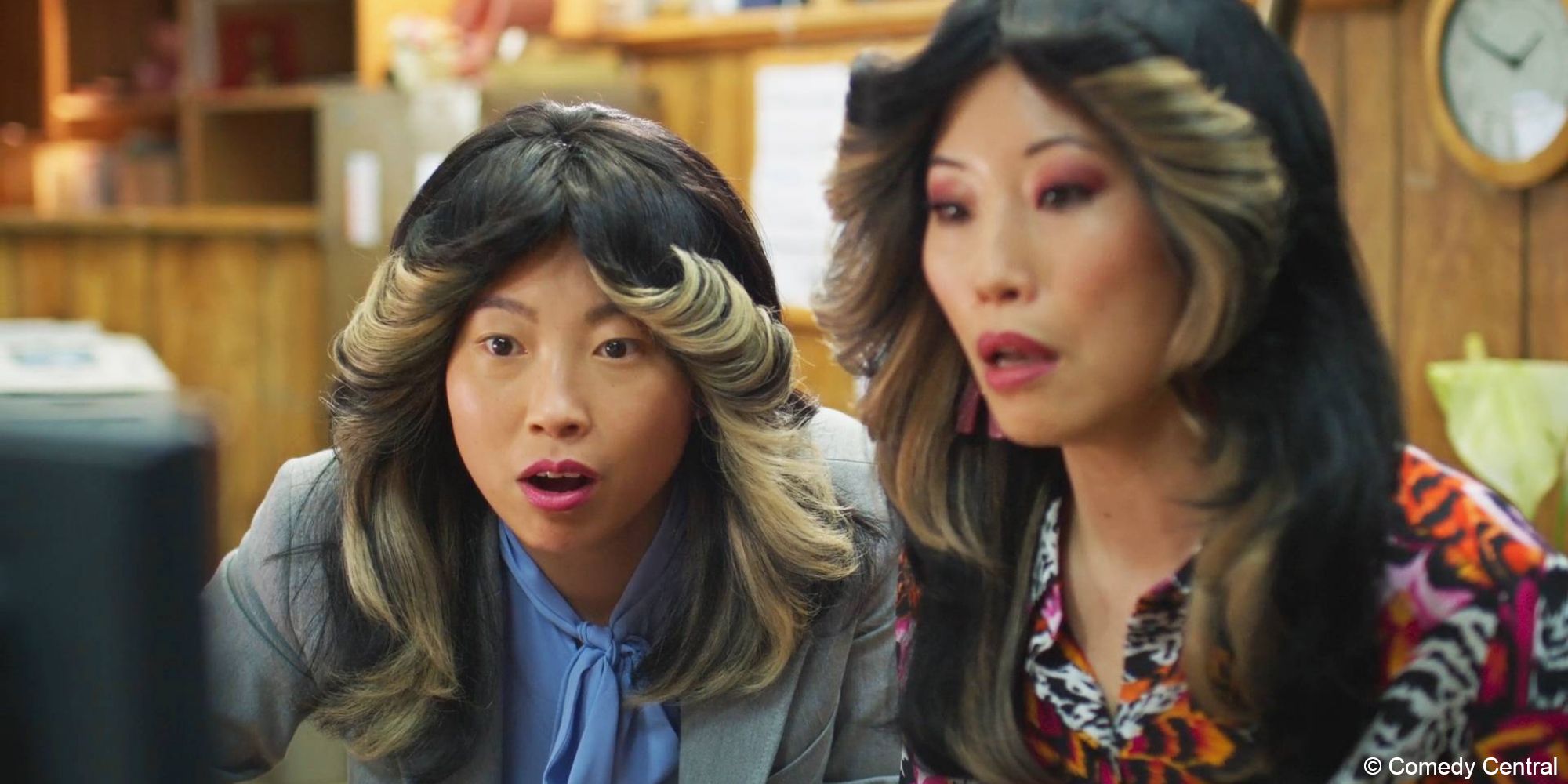 Awkwafina Is Nora From Queens_Nora and Nancy stare at a computer screen while sitting side by si