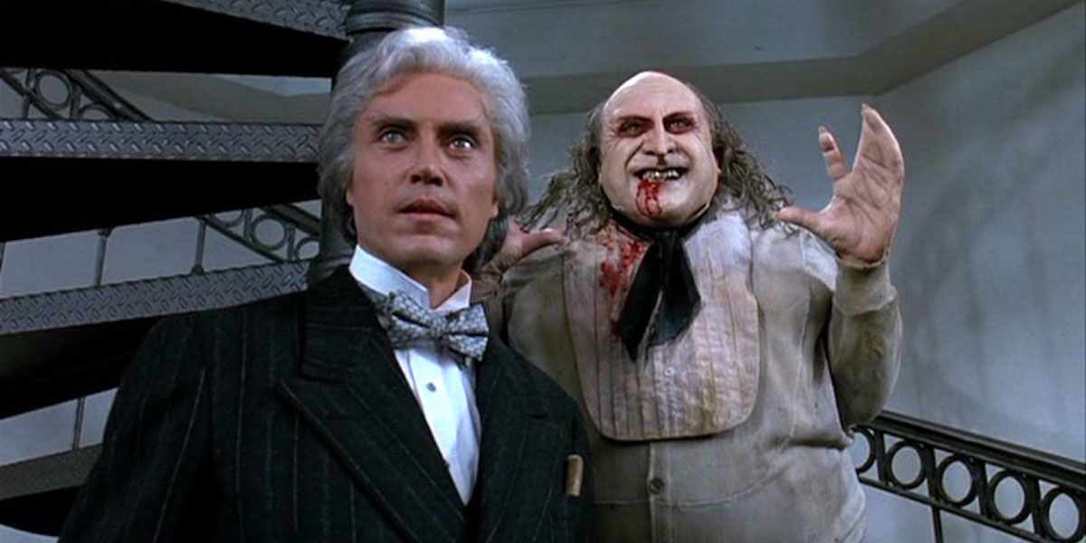 Max Shreck and Penguin smiling in Batman Returns.