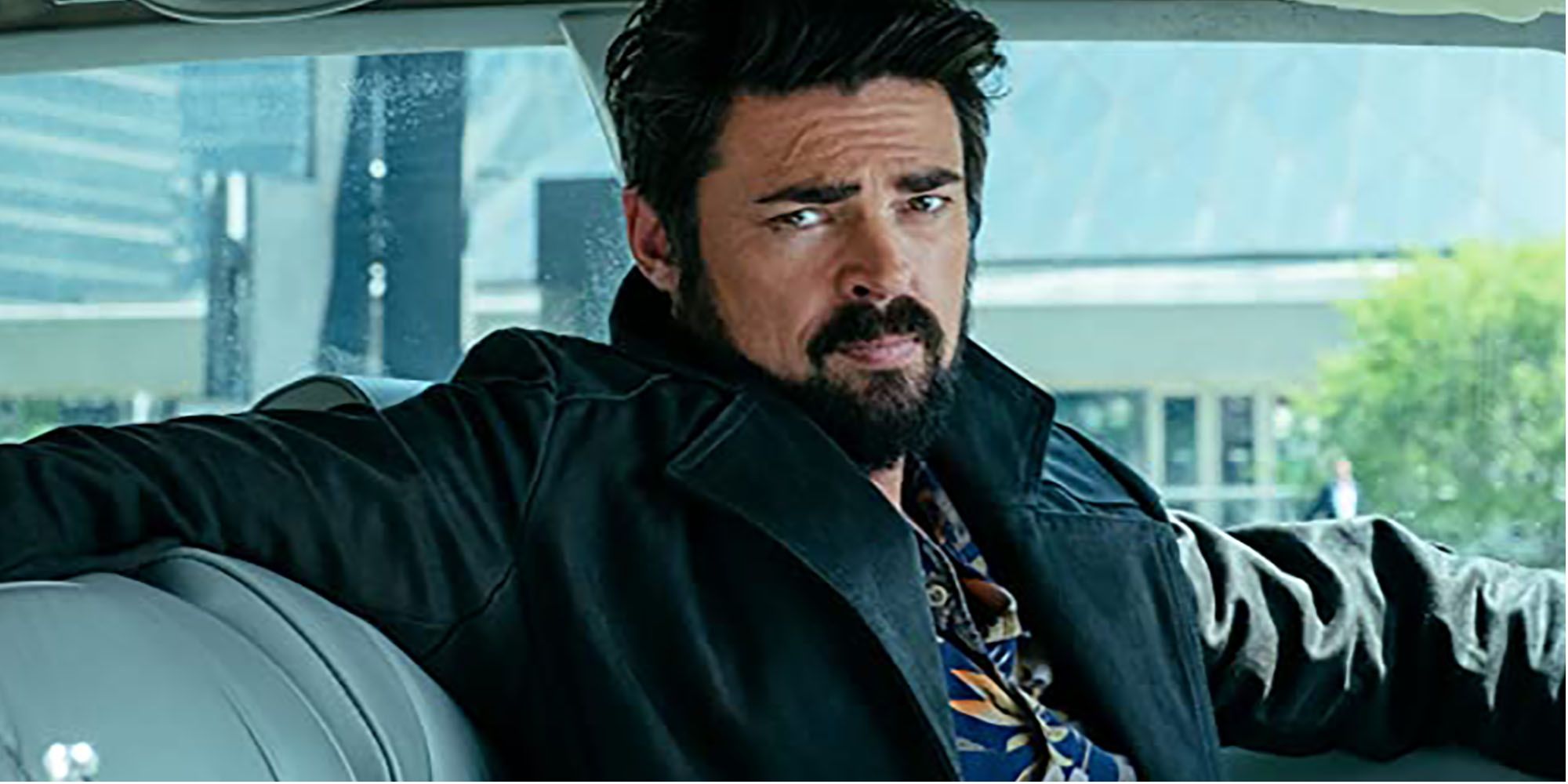 Karl Urban as Billy Butcher in The Boys staring out the window 
