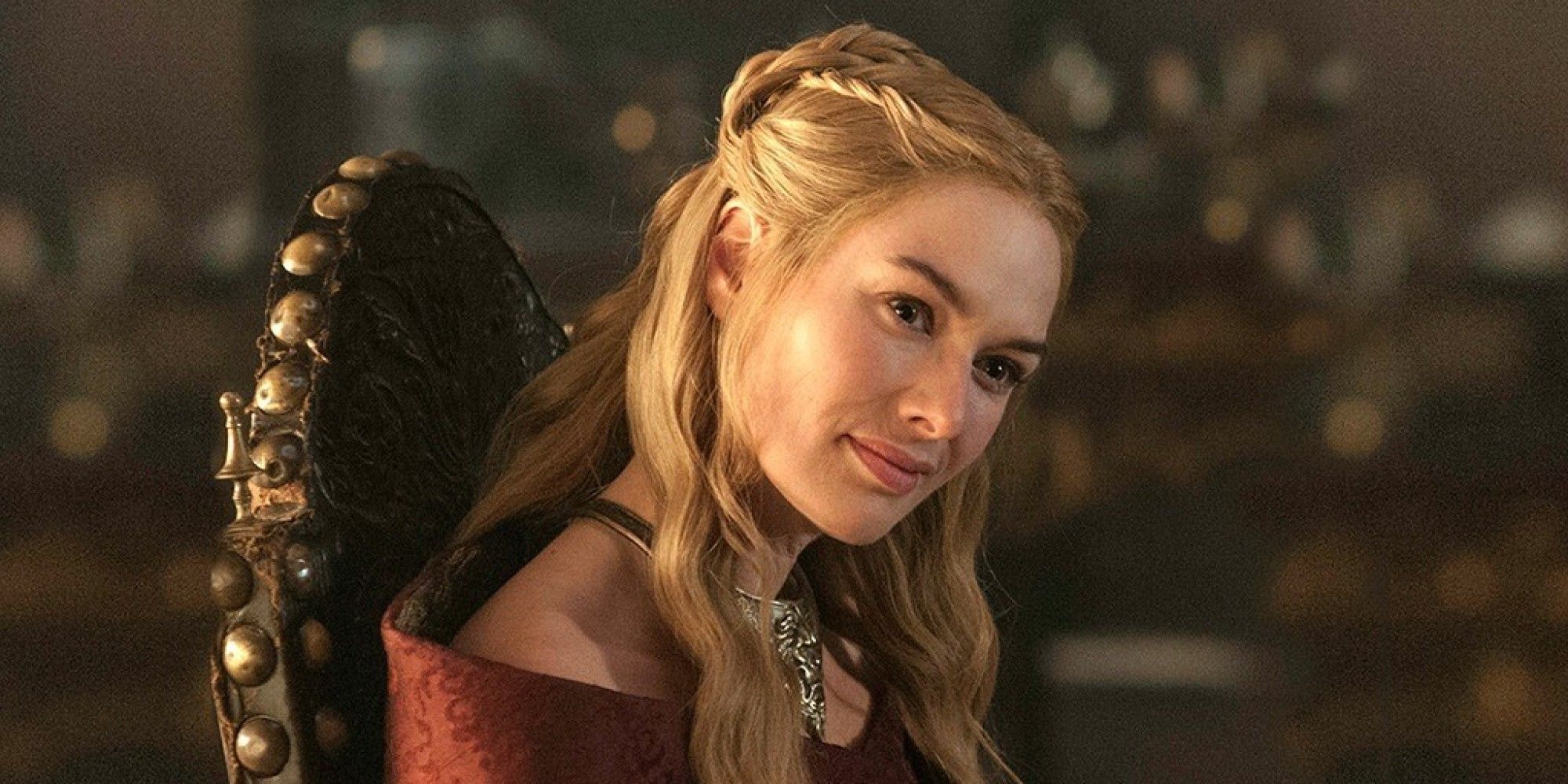 Lena Headey as Cersei Lannister smiling wickedly in Game of Thrones.