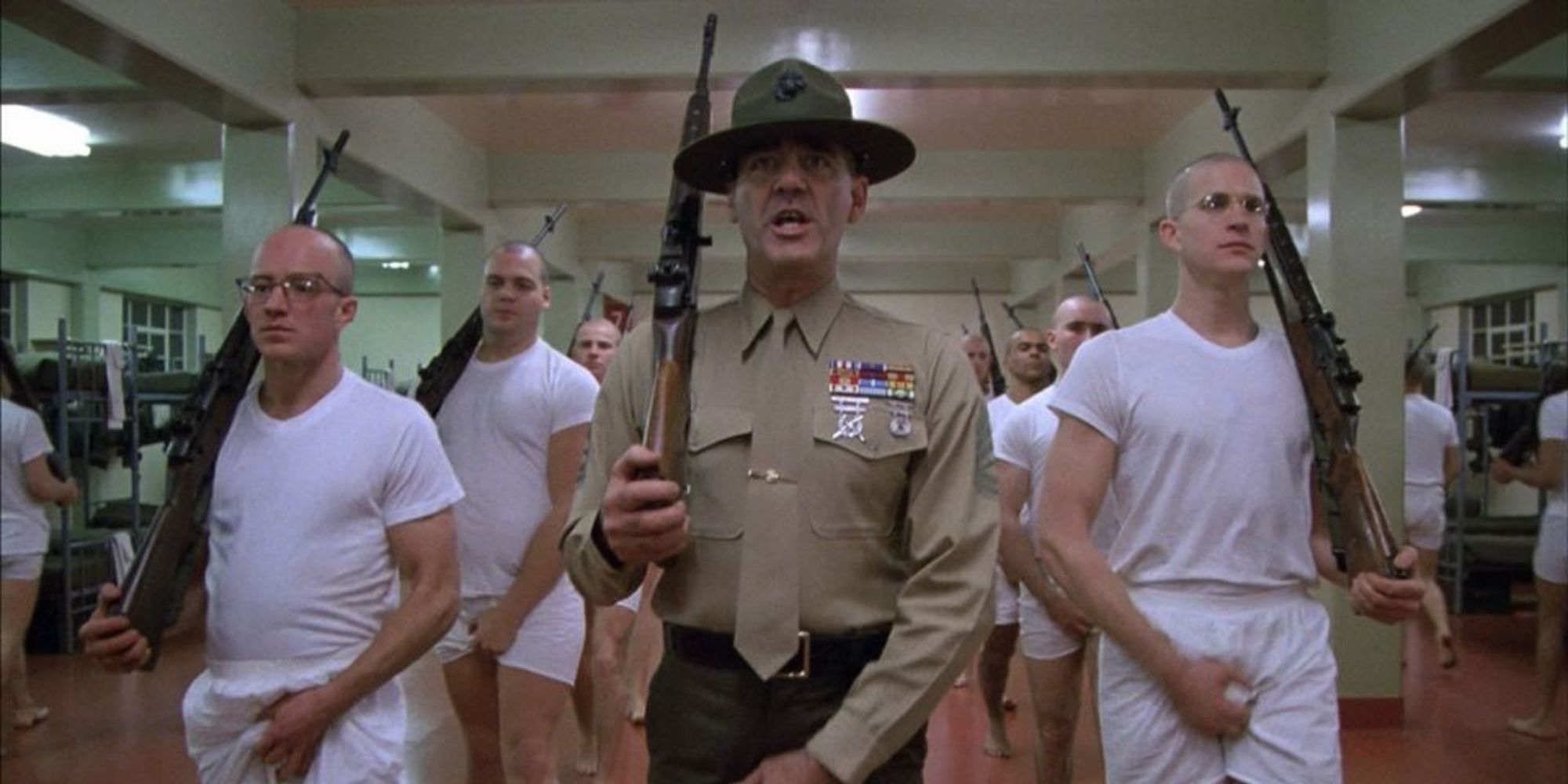 R. Lee Ermey as Gunnery Sergeant Hartman leading marines in Full Metal Jacket