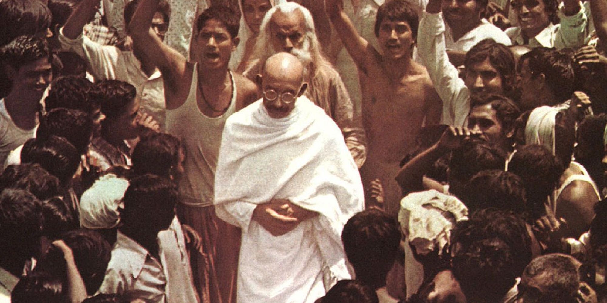 Gandhi walking through a crowd in the film 'Gandhi'