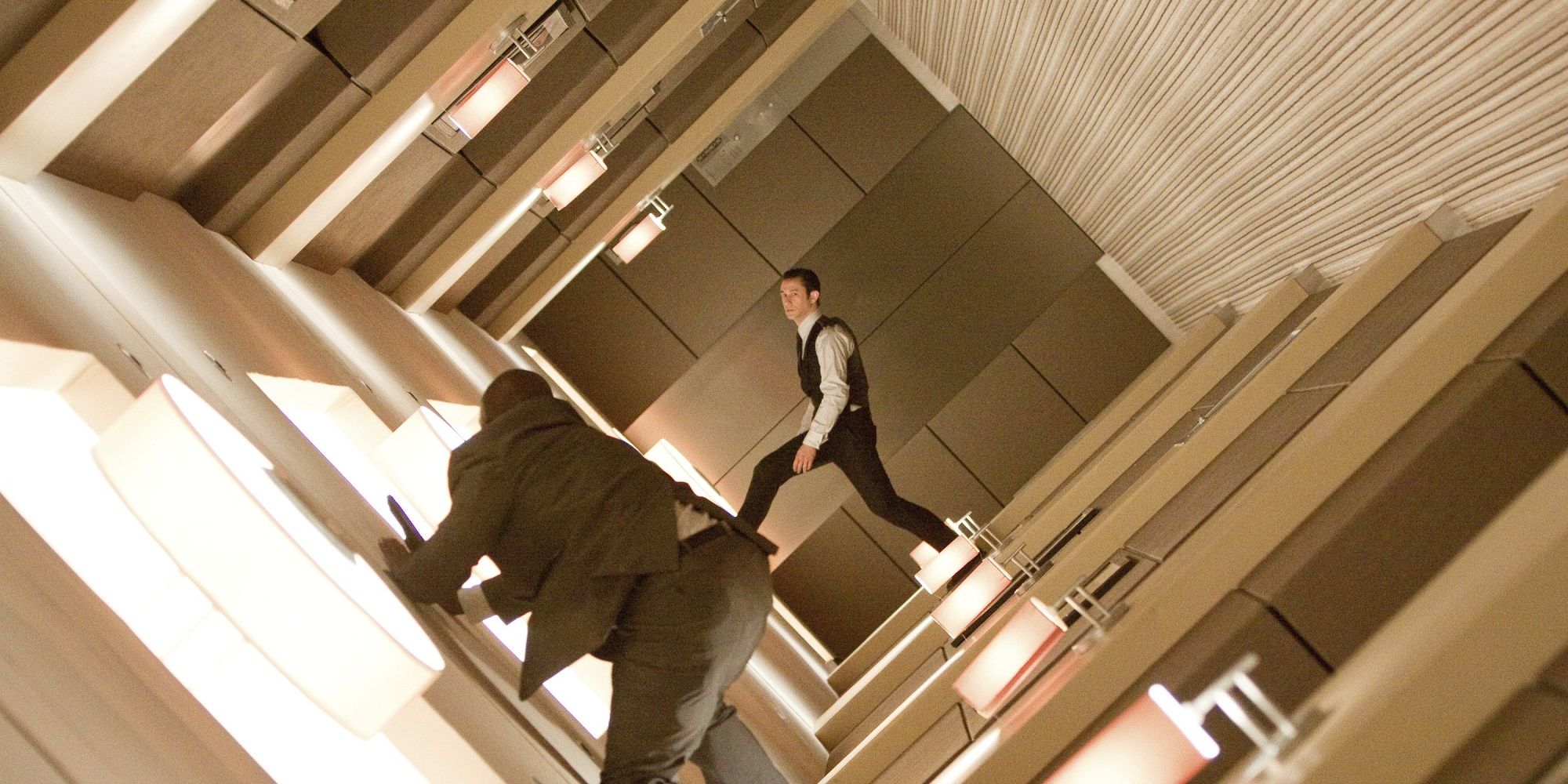 Arthur battling people in the upside down, turning hotel hallways.