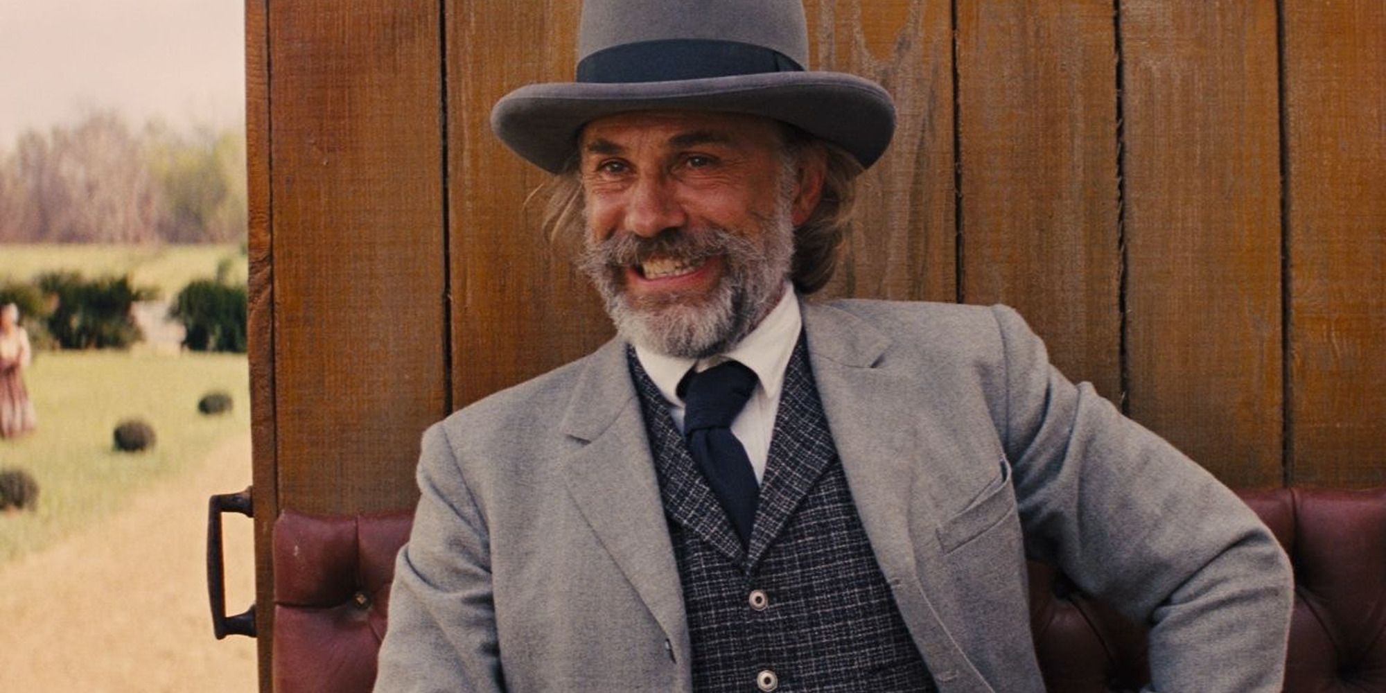 Christoph Waltz as King Schultz from Django Unchained with a huge smile on his face